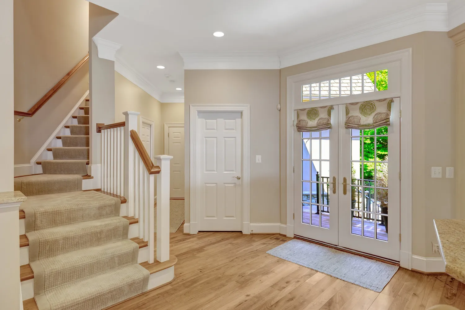 a white bath tub sitting in a bathroom next to a window