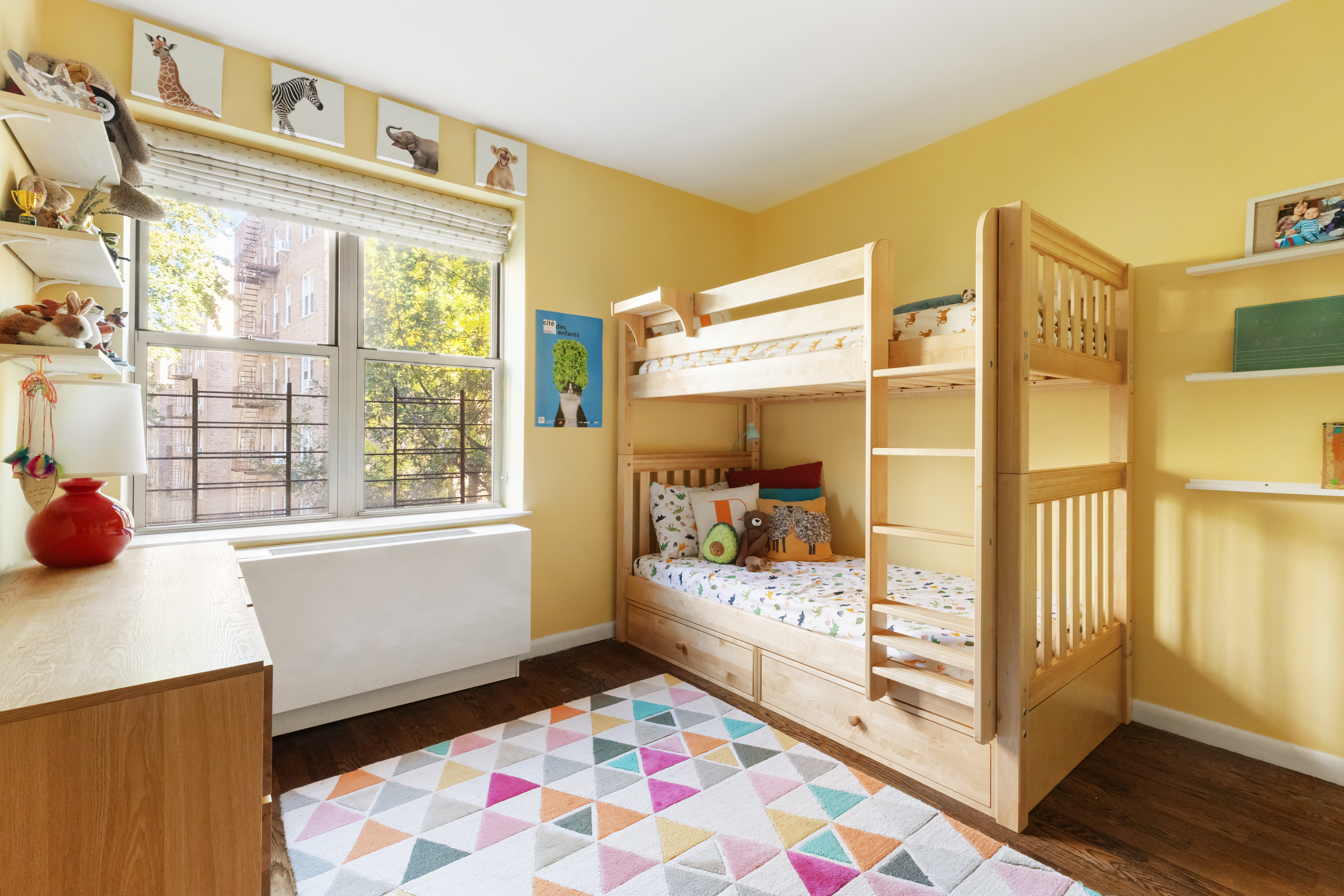 736 West 187th Street, Unit 303 Manhattan, NY 10033 - Photo 9 of 16 a bedroom with a bed and wooden floor