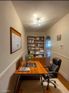 a room with furniture pool table and chair