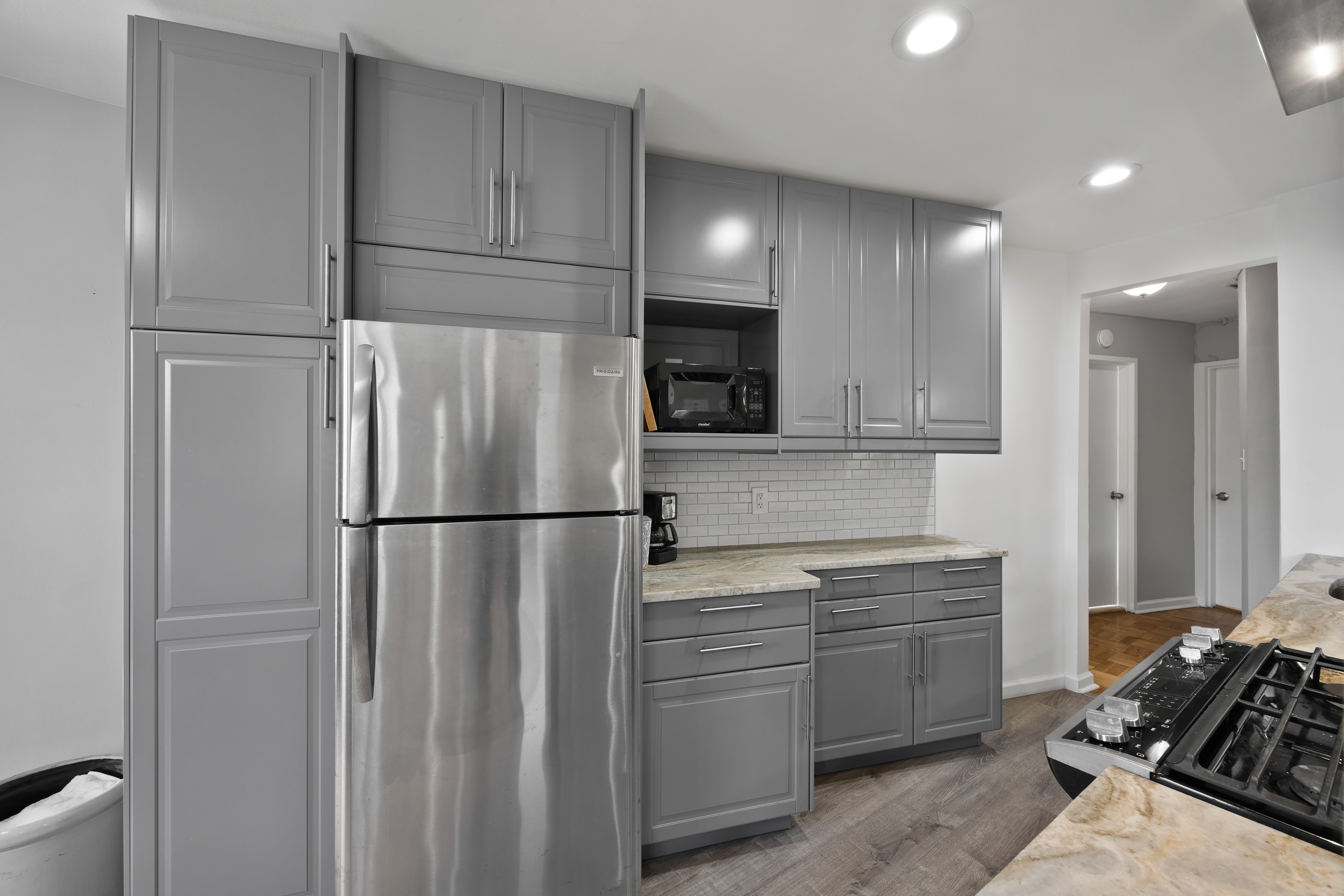255 Fieldston Terrace, Unit 2L Bronx, NY 10471 - Photo 9 of 32 a kitchen with a refrigerator sink and cabinets