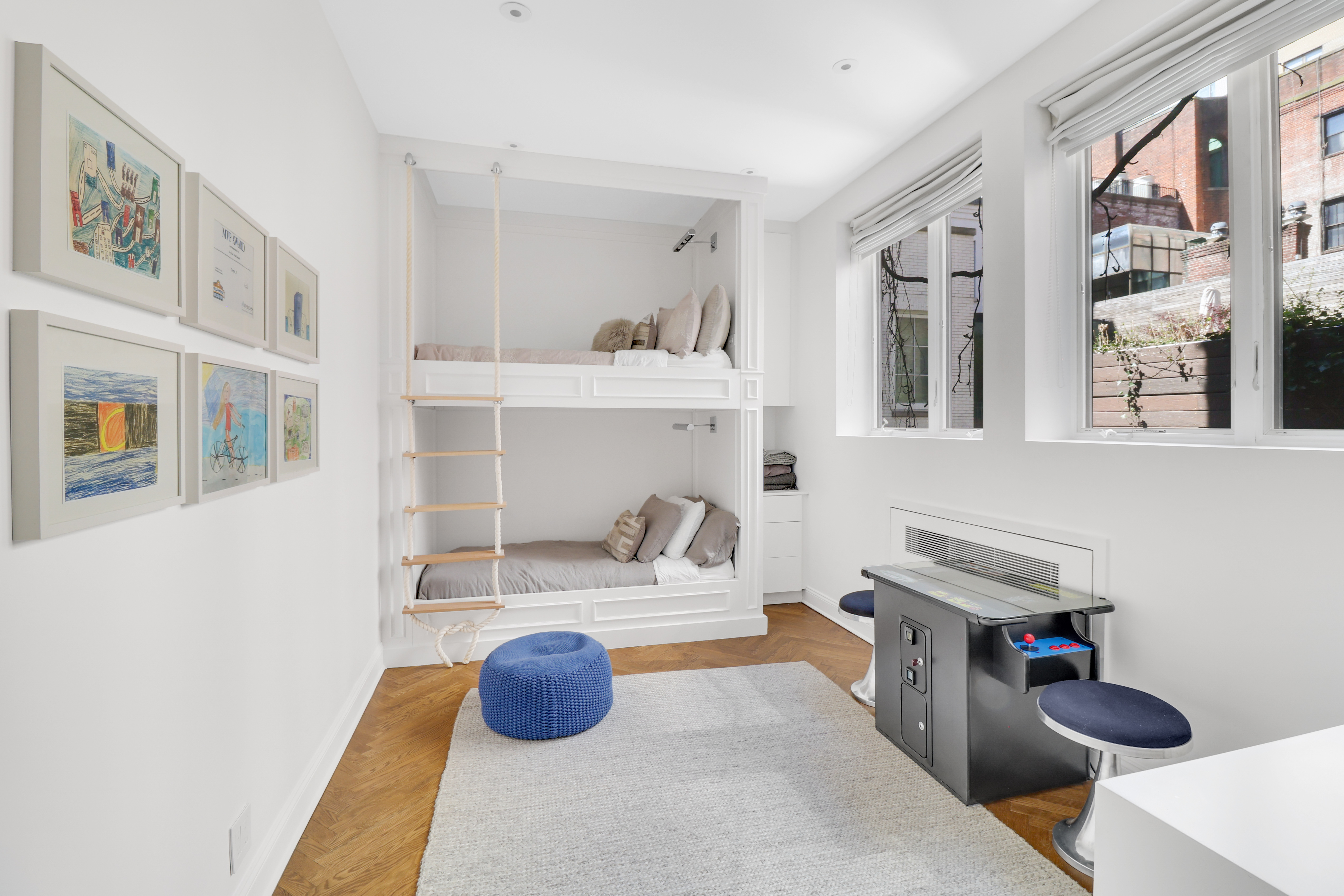14 East 68th Street, Unit 3 Manhattan, NY 10065 - Photo 12 of 16 a bedroom with furniture and a mirror