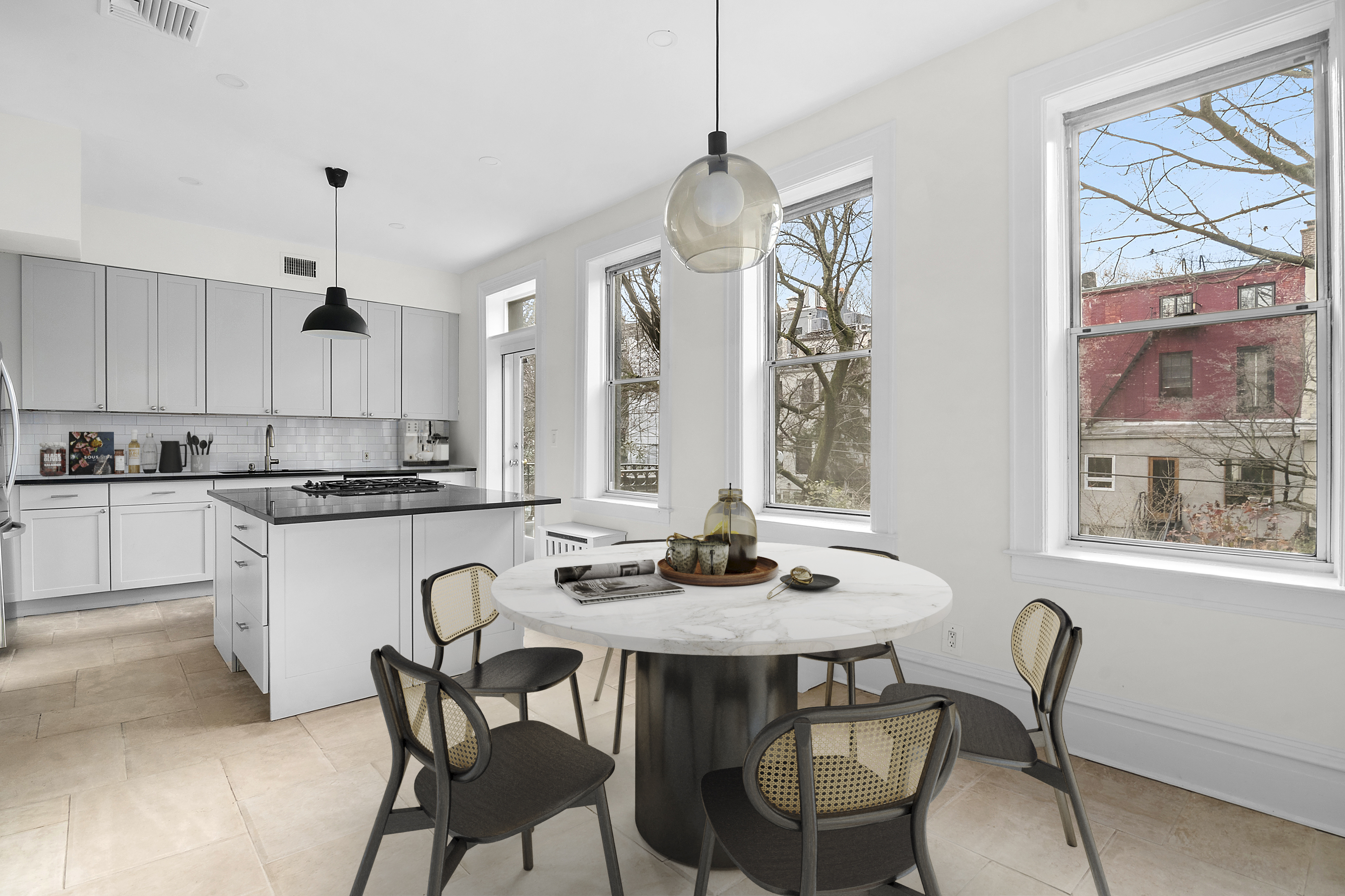188 Warren Street, Unit TRIPLEX Brooklyn, NY 11201 - Photo 4 of 15 a kitchen with a dining table chairs sink and stove