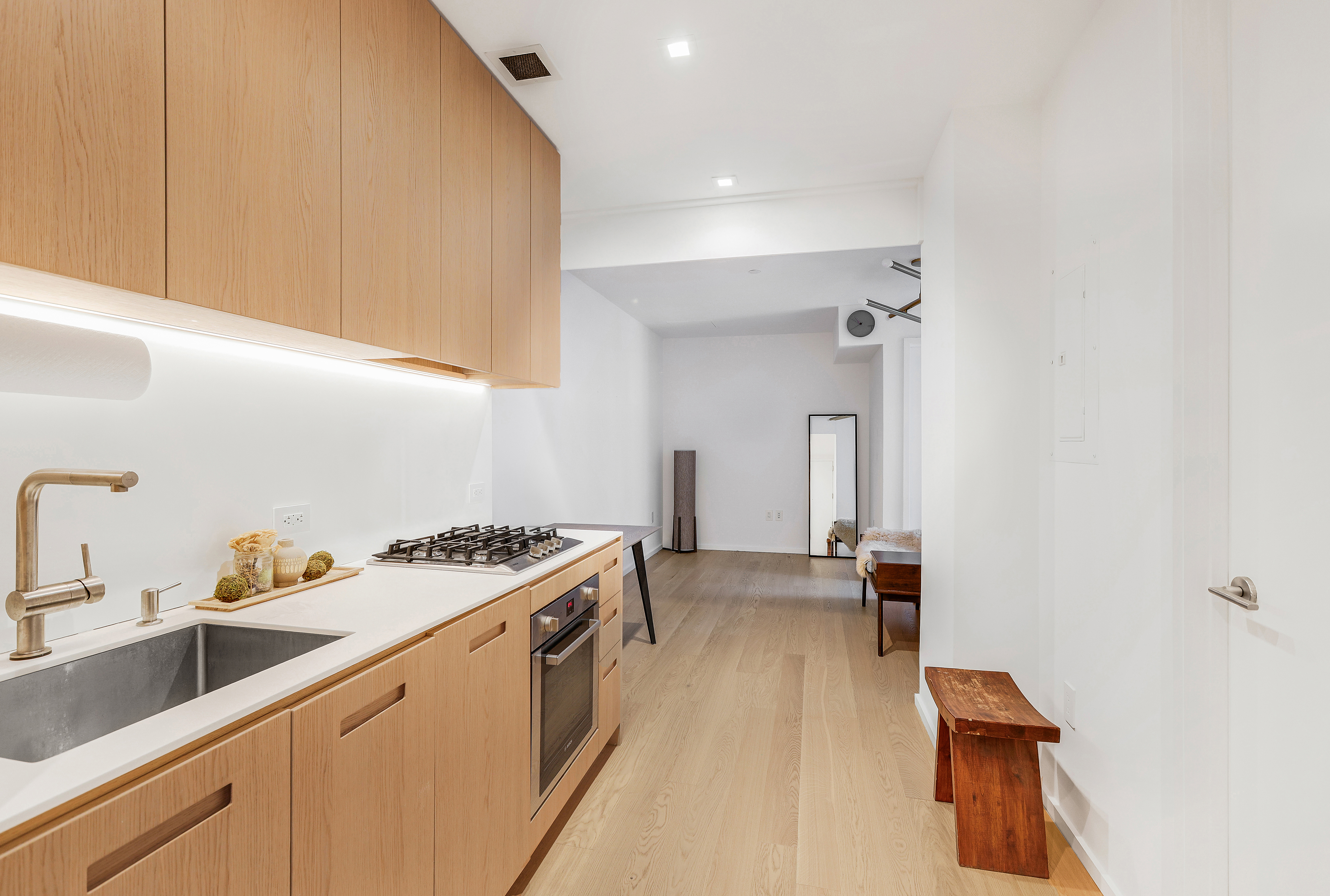 98 Front Street, Unit 9A Brooklyn, NY 11201 - Photo 4 of 31 a kitchen that has a sink and a stove