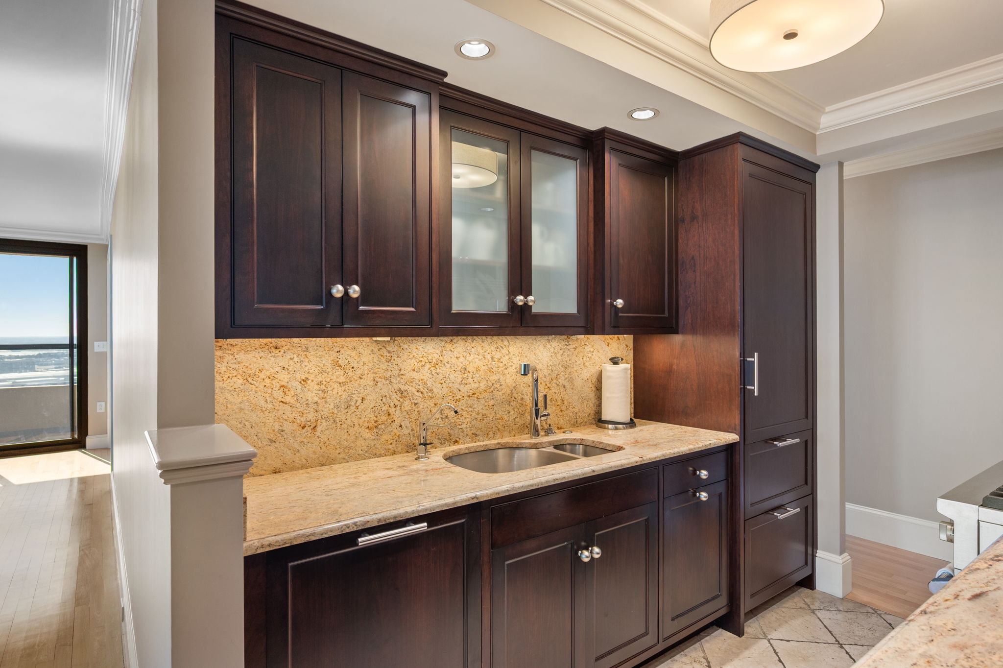 65 East India Row, Unit 38 F/G Boston, MA 02110 - Photo 9 of 32 a bathroom with a granite countertop sink and a mirror