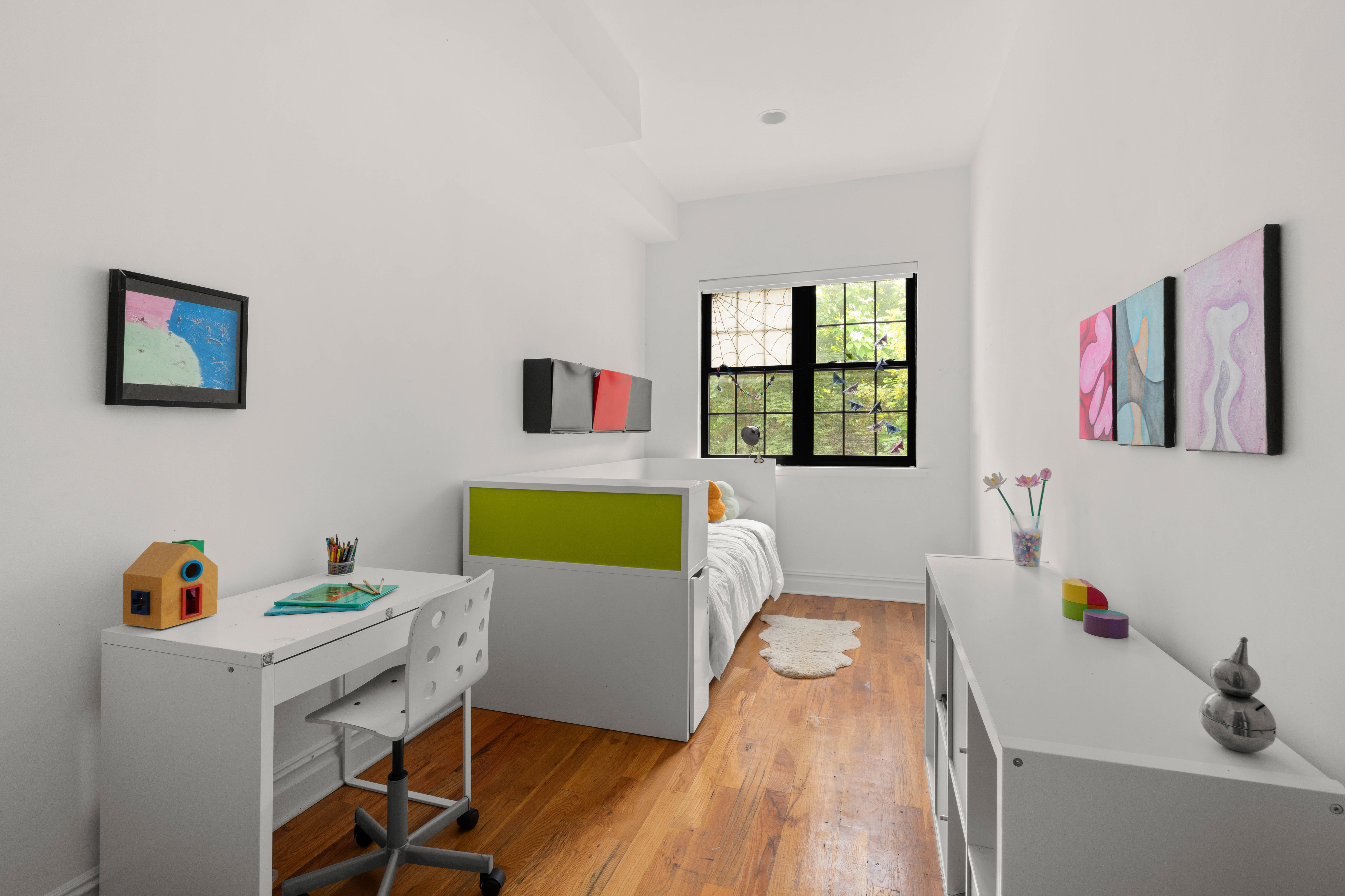 748 Madison Street, Unit 1 Brooklyn, NY 11221 - Photo 5 of 10 a living room with furniture and a window