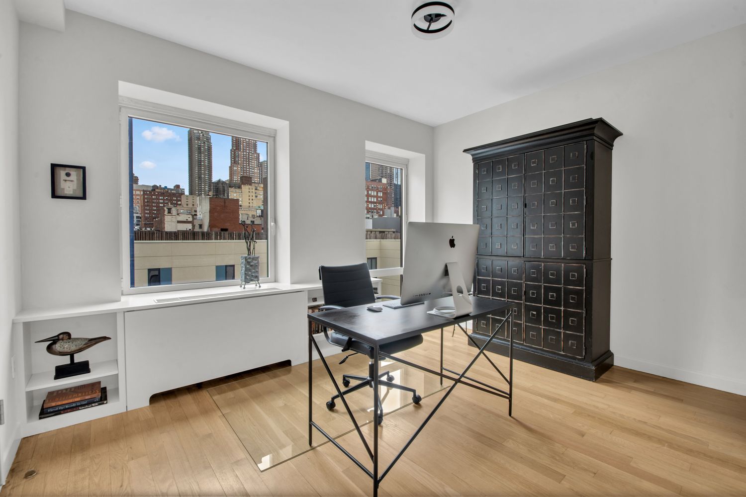 454 West 54th Street, Unit PHC Manhattan, NY 10019 - Photo 7 of 27 a workspace with furniture and window