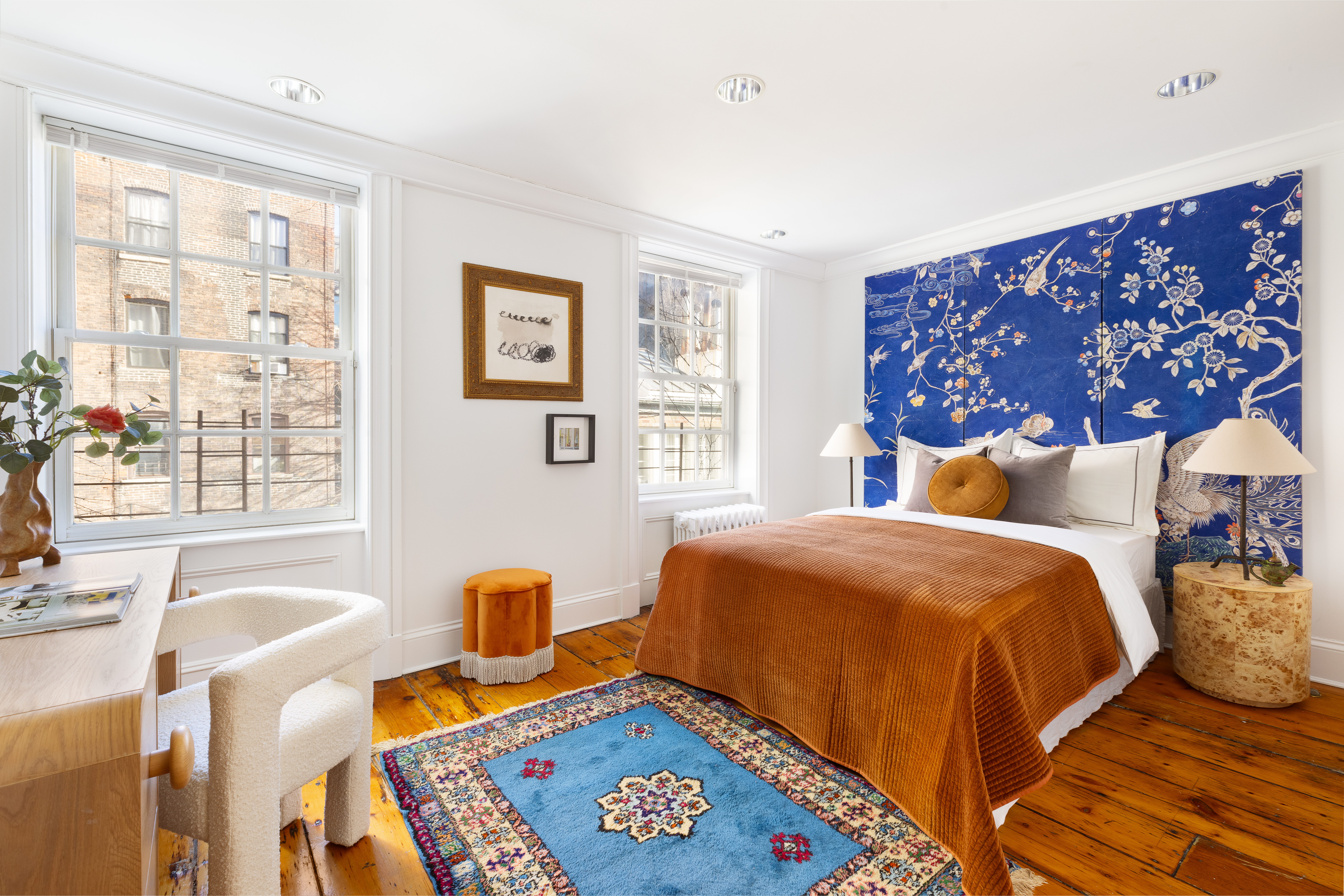 313 West 20th Street Manhattan, NY 10011 - Photo 16 of 20 a bedroom with a bed and wooden floor