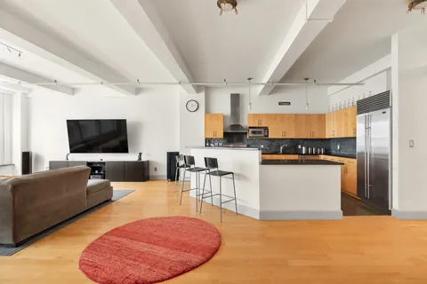 a kitchen with stainless steel appliances granite countertop a stove and a sink