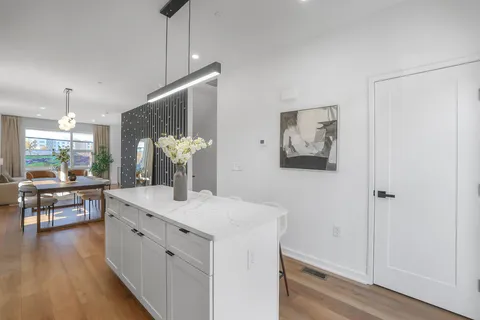 a kitchen with a sink and a refrigerator