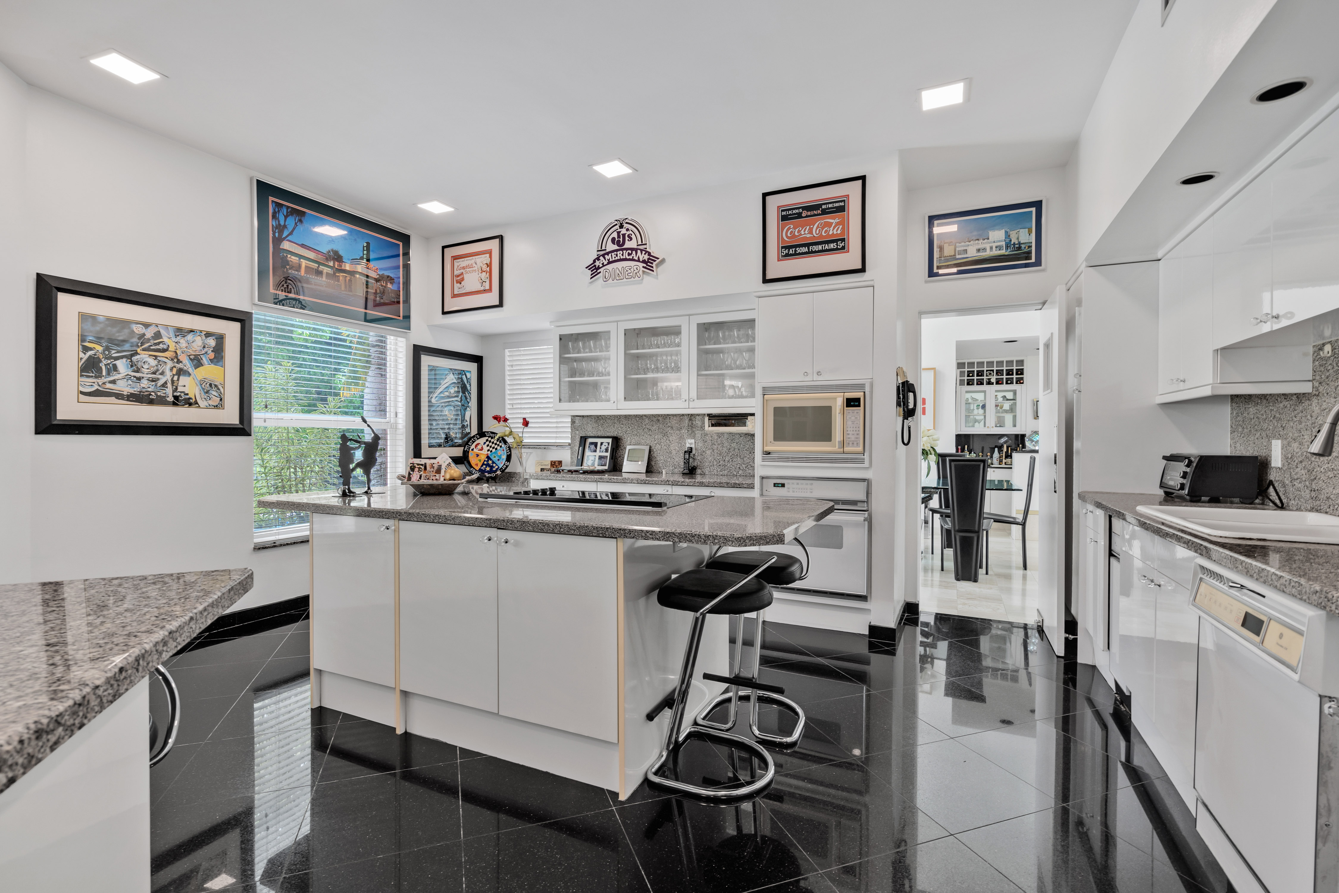 8768 Southwest 62nd Court Miami, FL 33156 - Photo 17 of 56 a kitchen with stainless steel appliances granite countertop a refrigerator and stove
