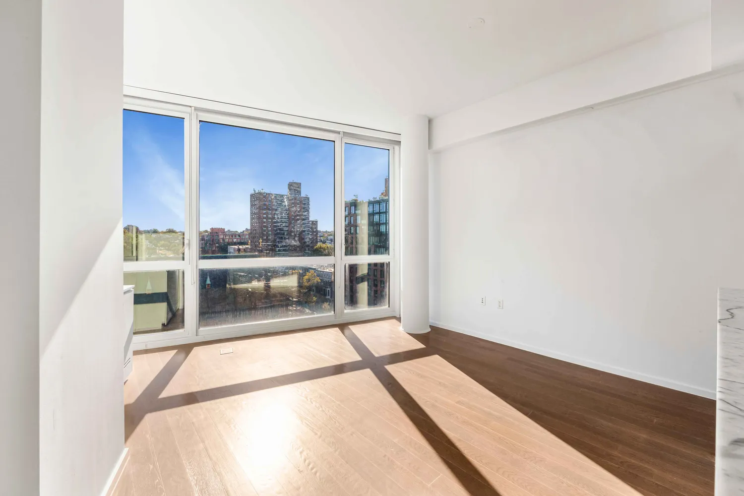 a view of a living room with a large window