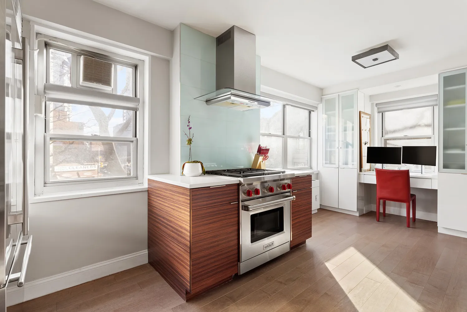 a kitchen with stainless steel appliances granite countertop a stove and a refrigerator