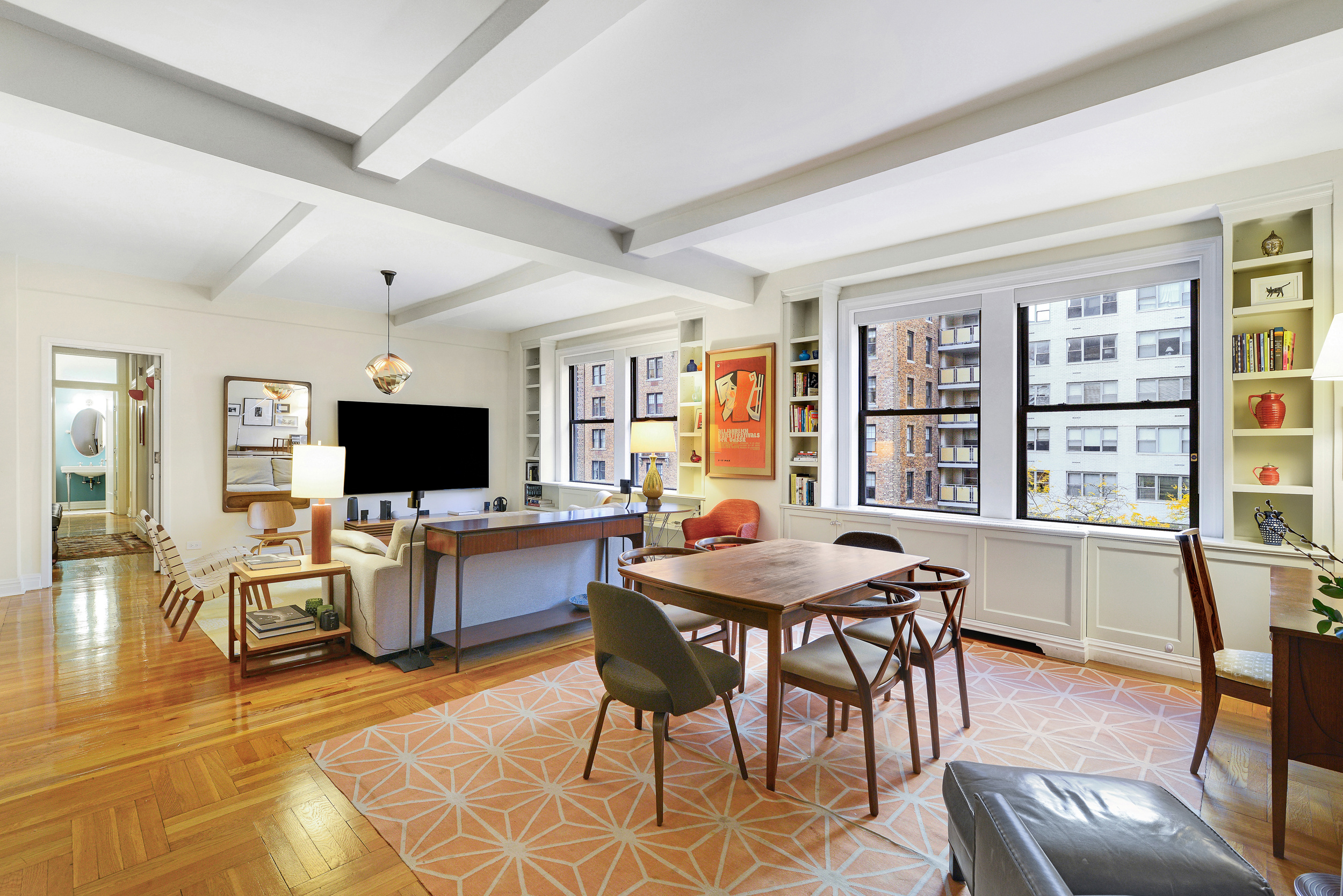 20 West 72nd Street, Unit 601 Manhattan, NY 10023 - Photo 4 of 21 a view of a livingroom with furniture and a flat screen tv