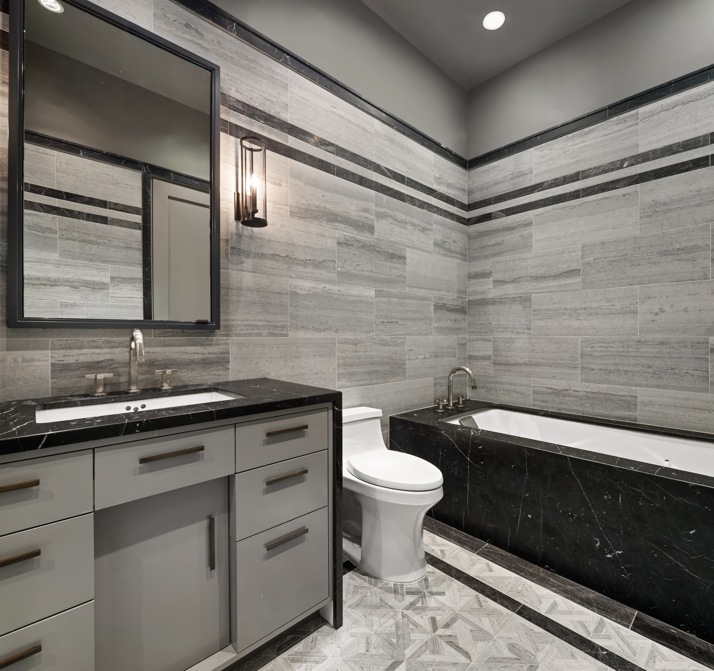 114 Liberty Street, Unit 2A Manhattan, NY 10006 - Photo 13 of 17 a bathroom with a sink a toilet a mirror and shower