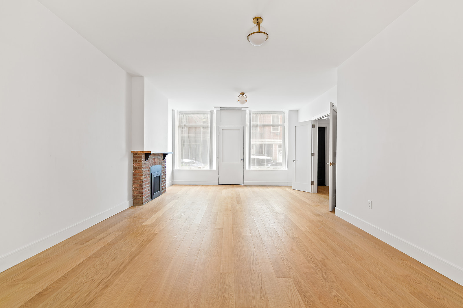 69 Hudson Avenue, Unit HSE Brooklyn, NY 11201 - Photo 3 of 20 a view of empty room with wooden floor and window