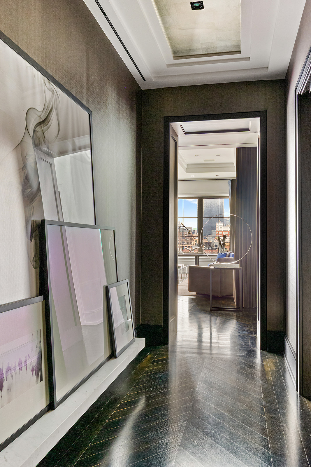 212 West 18th Street, Unit 12E Manhattan, NY 10011 - Photo 8 of 13 a view of a hallway view with wooden floor and a living room
