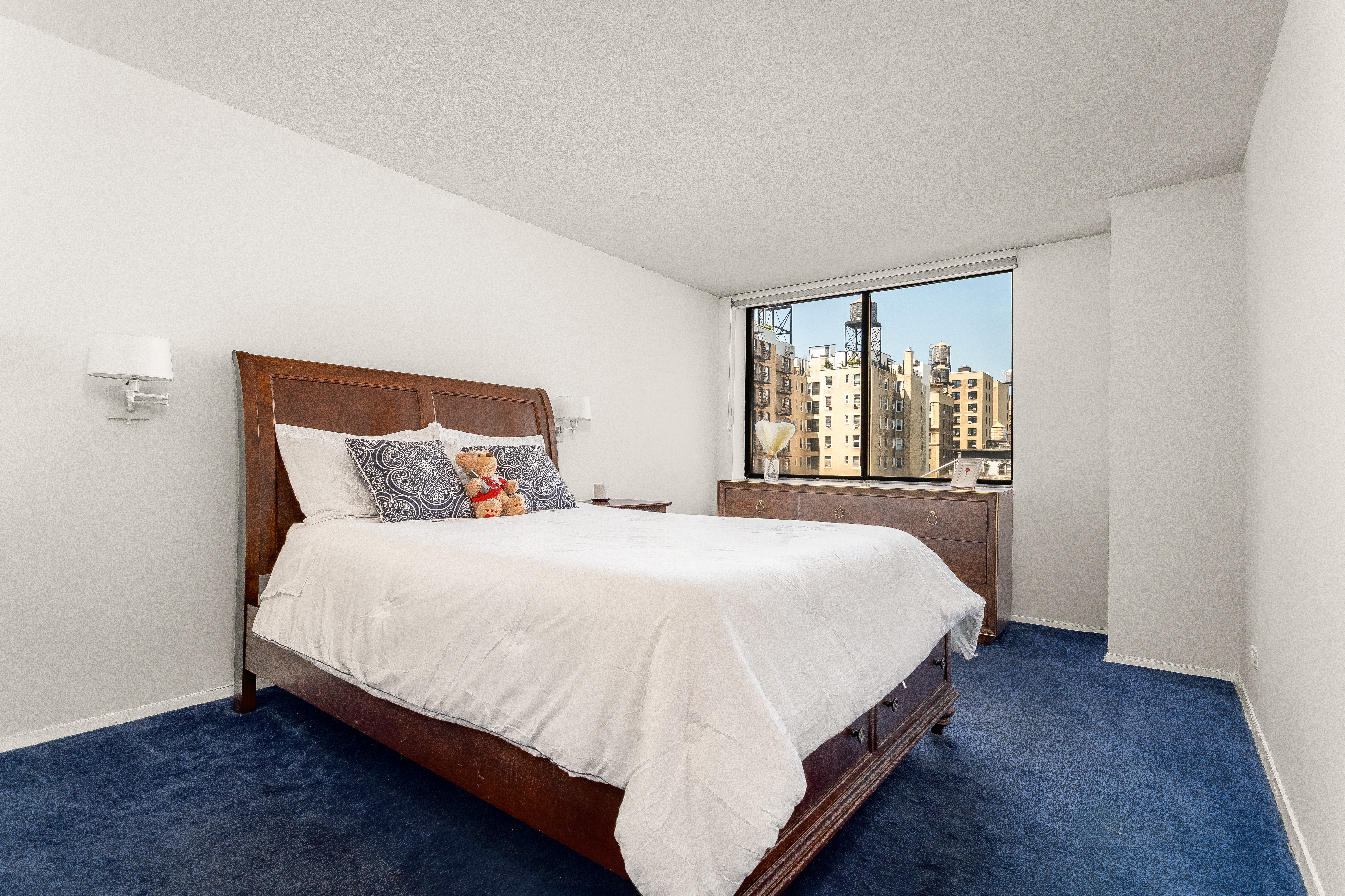 275 West 96th Street, Unit 12B Manhattan, NY 10025 - Photo 9 of 28 a bedroom with a bed and window