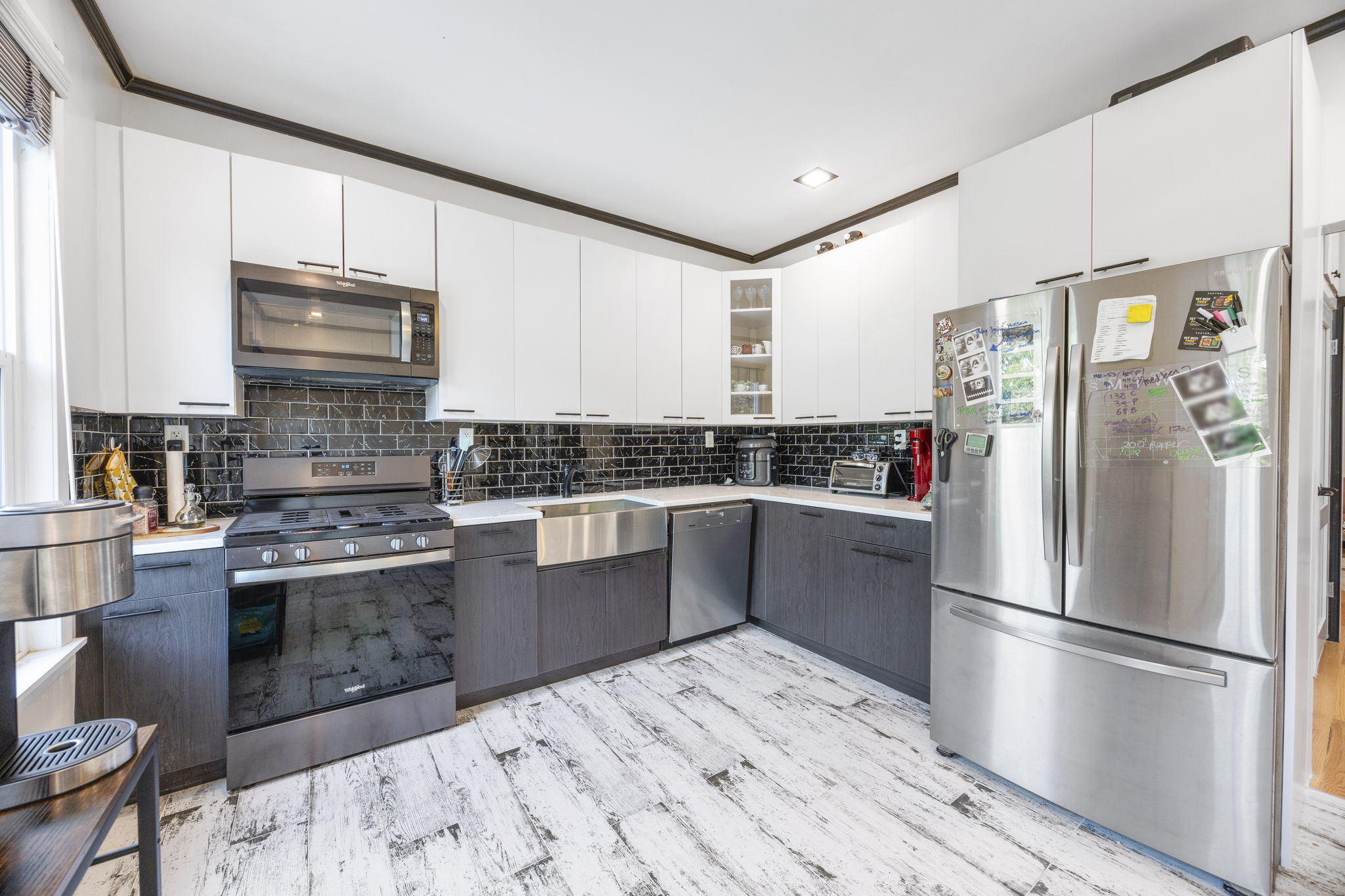 25-69 46th Street Queens, NY 11103 - Photo 8 of 33 a kitchen with granite countertop a refrigerator stove and sink