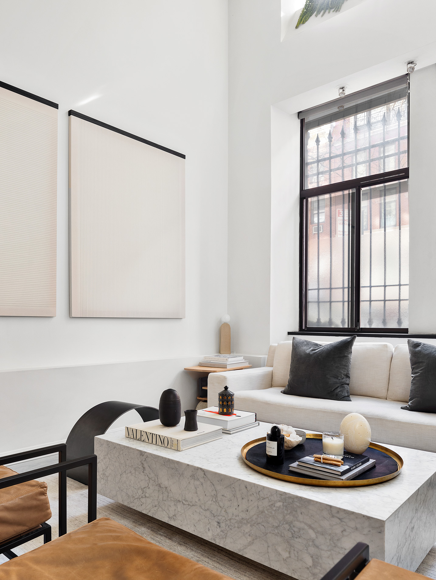 155 West 15th Street, Unit 1J Manhattan, NY 10011 - Photo 3 of 13 a living room with furniture and a potted plant