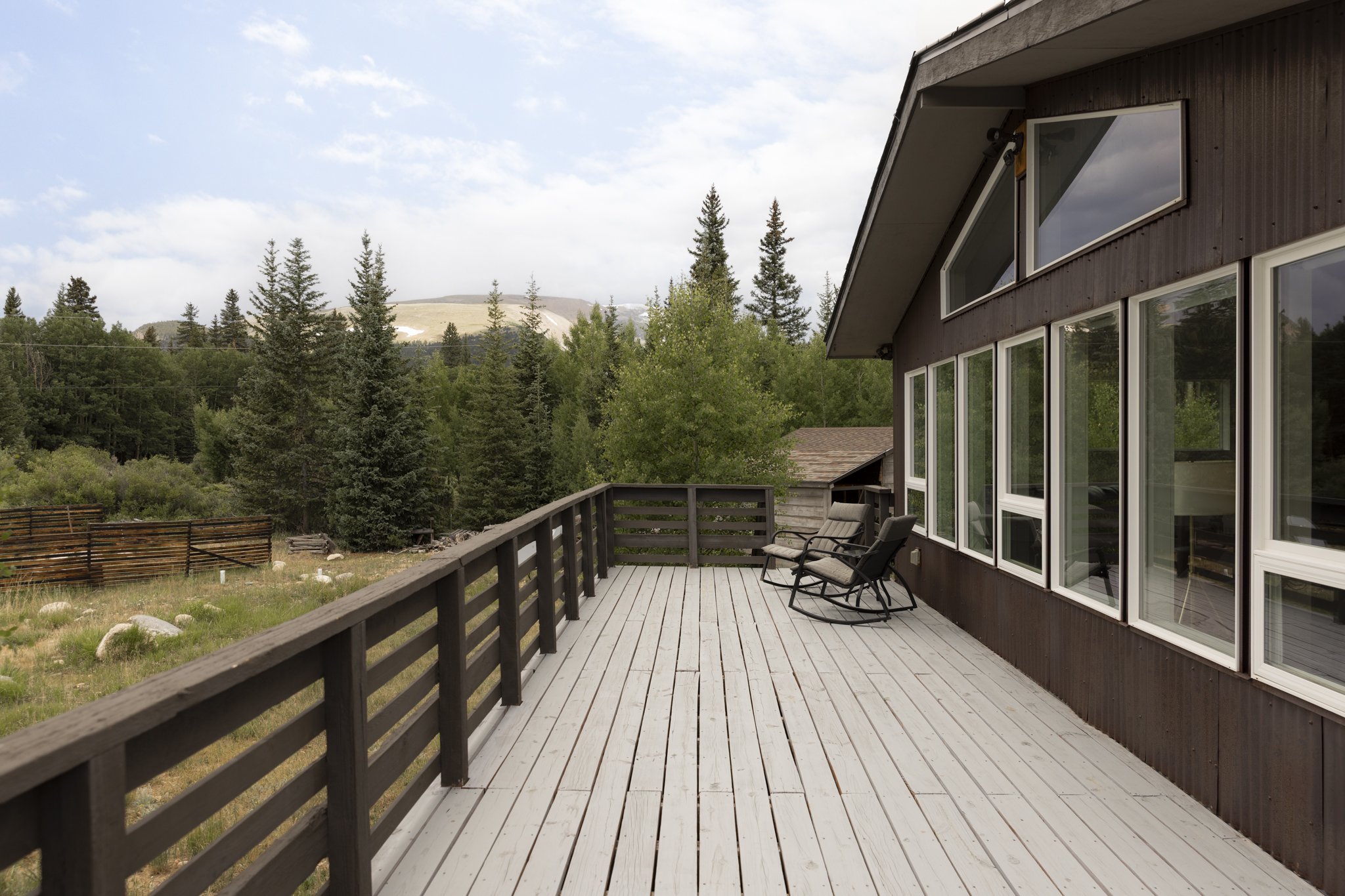 133 Gold Run Road Alma, CO 80420 - Photo 32 of 46 a view of a balcony with two chairs and wooden floor