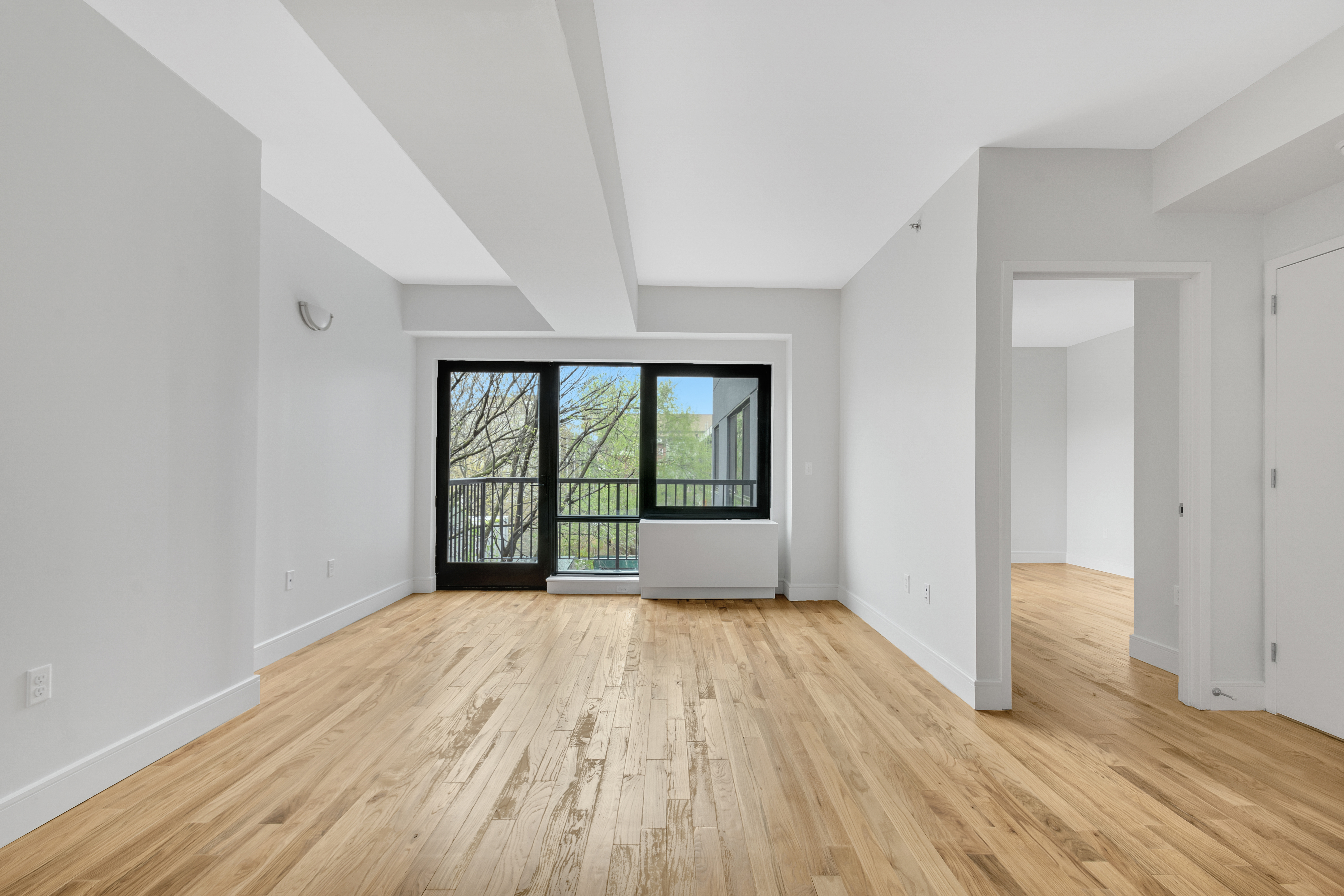 142 Richards Street, Unit 2E Brooklyn, NY 11231 - Photo 2 of 7 wooden floor in an empty room with a window