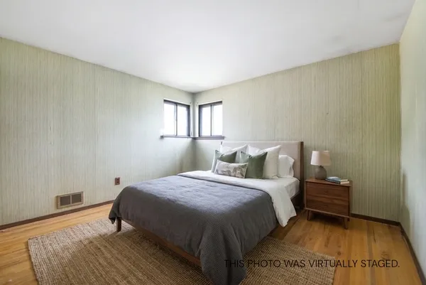 a bedroom with a bed and window