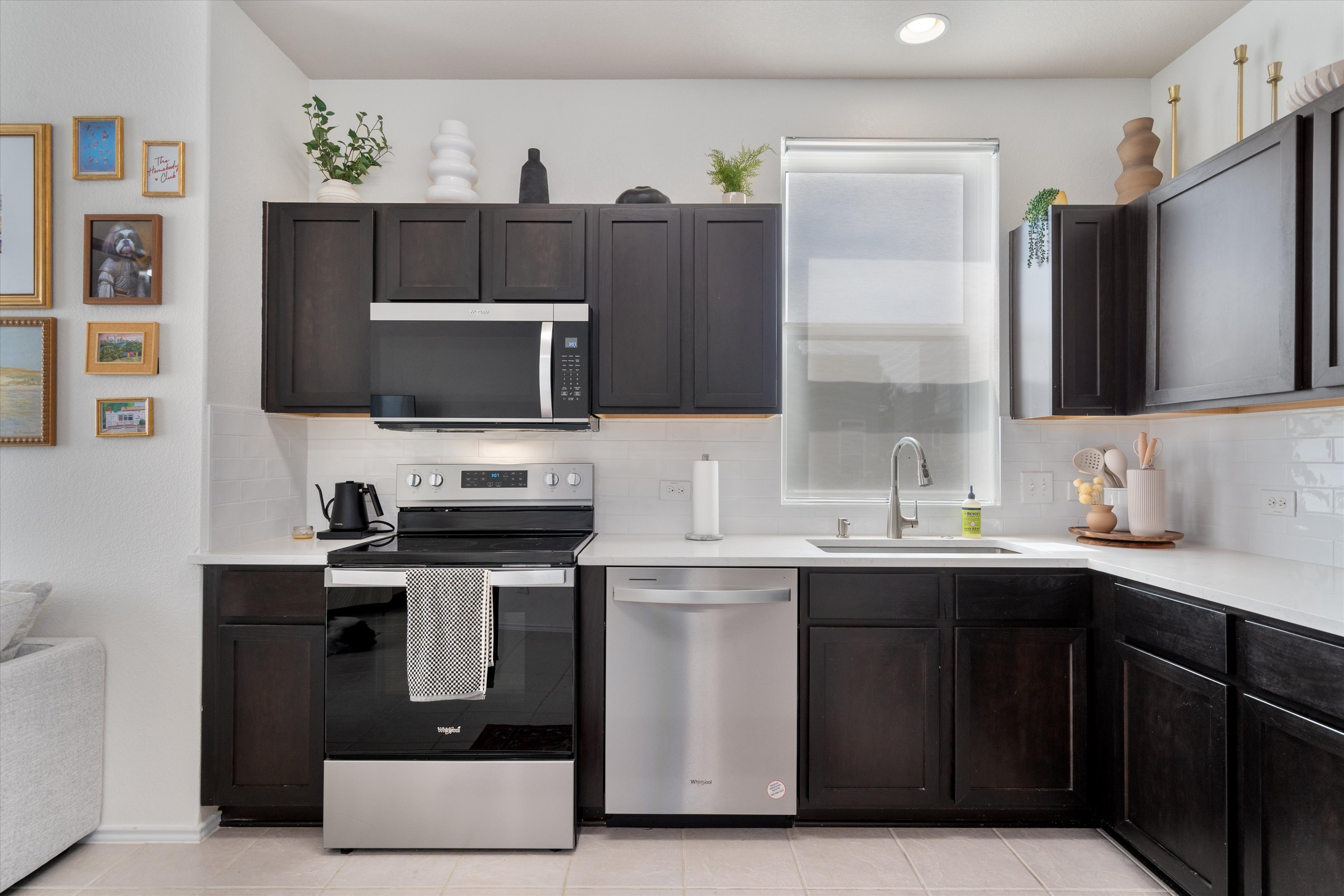 4330 Olenick Street Austin, TX 78723 - Photo 21 of 29 a kitchen with stainless steel appliances a sink stove and refrigerator