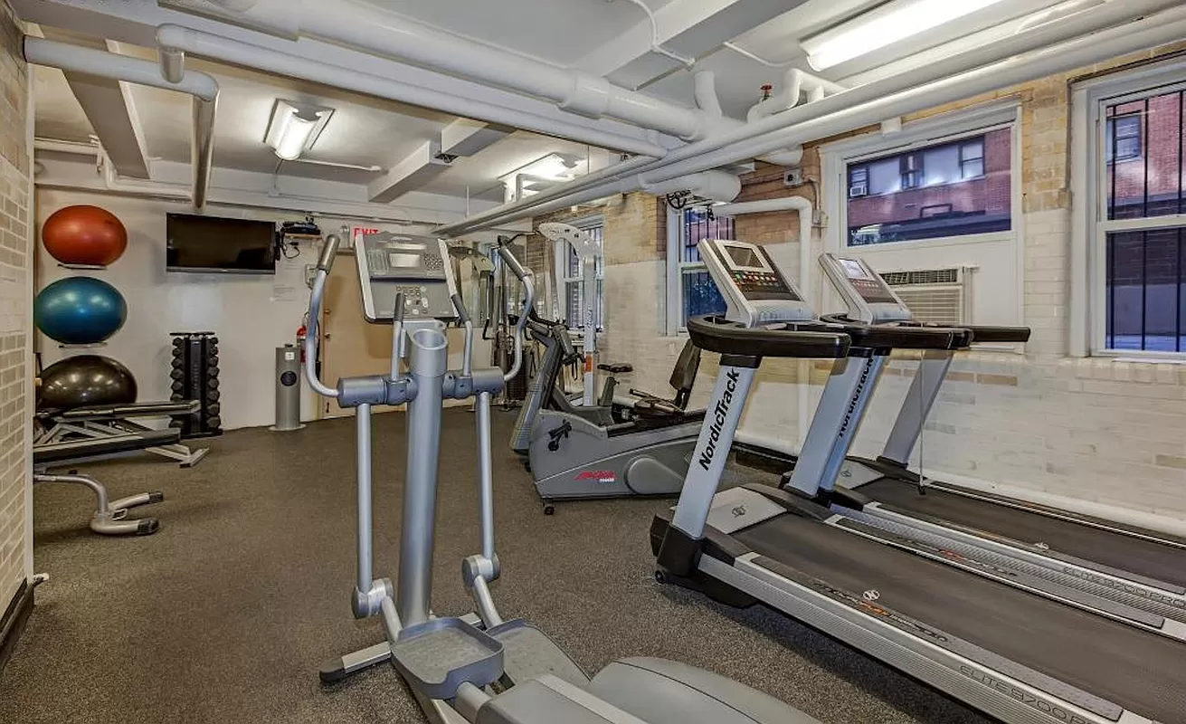 410 East 57th Street, Unit 15B Manhattan, NY 10022 - Photo 16 of 17 a view of a room with gym equipment