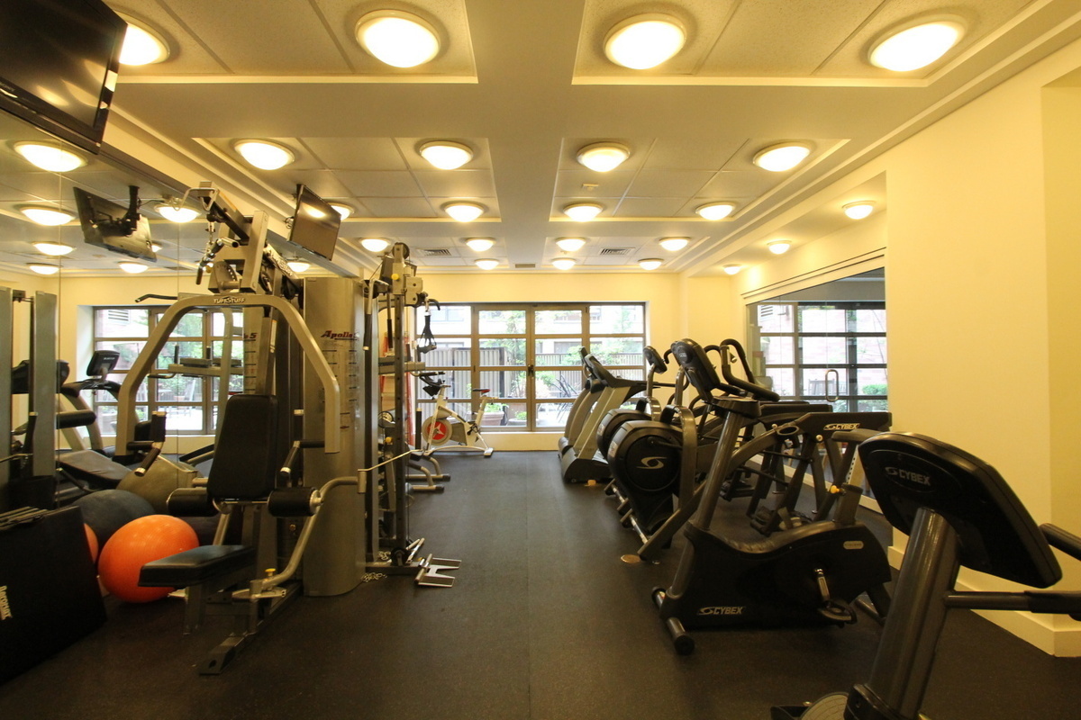 400 East 90th Street, Unit 7E Manhattan, NY 10128 - Photo 9 of 12 a view of a room with gym equipment