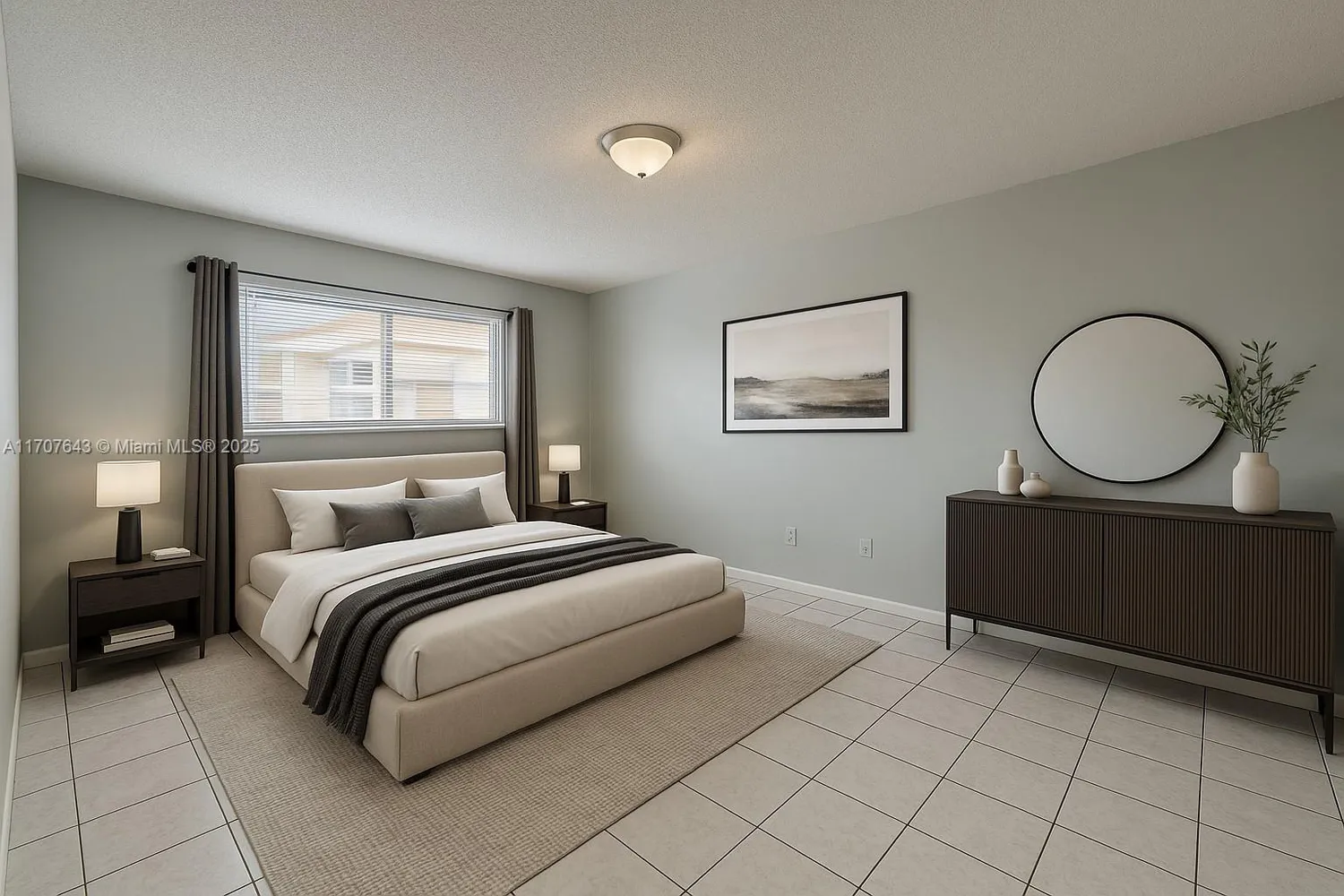 a bedroom with a bed mirror and window
