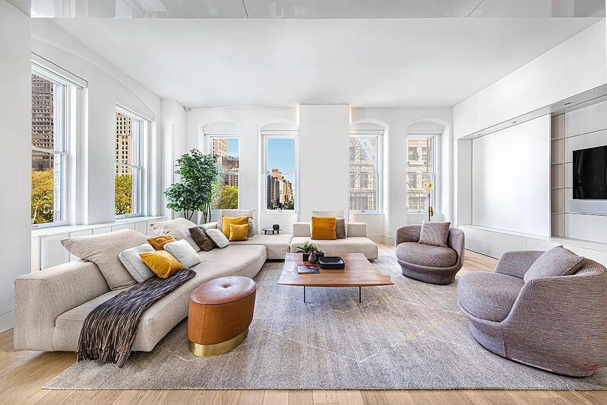 186 5th Avenue, Unit 4A Manhattan, NY 10010 - Photo 2 of 12 a living room with furniture and a large window