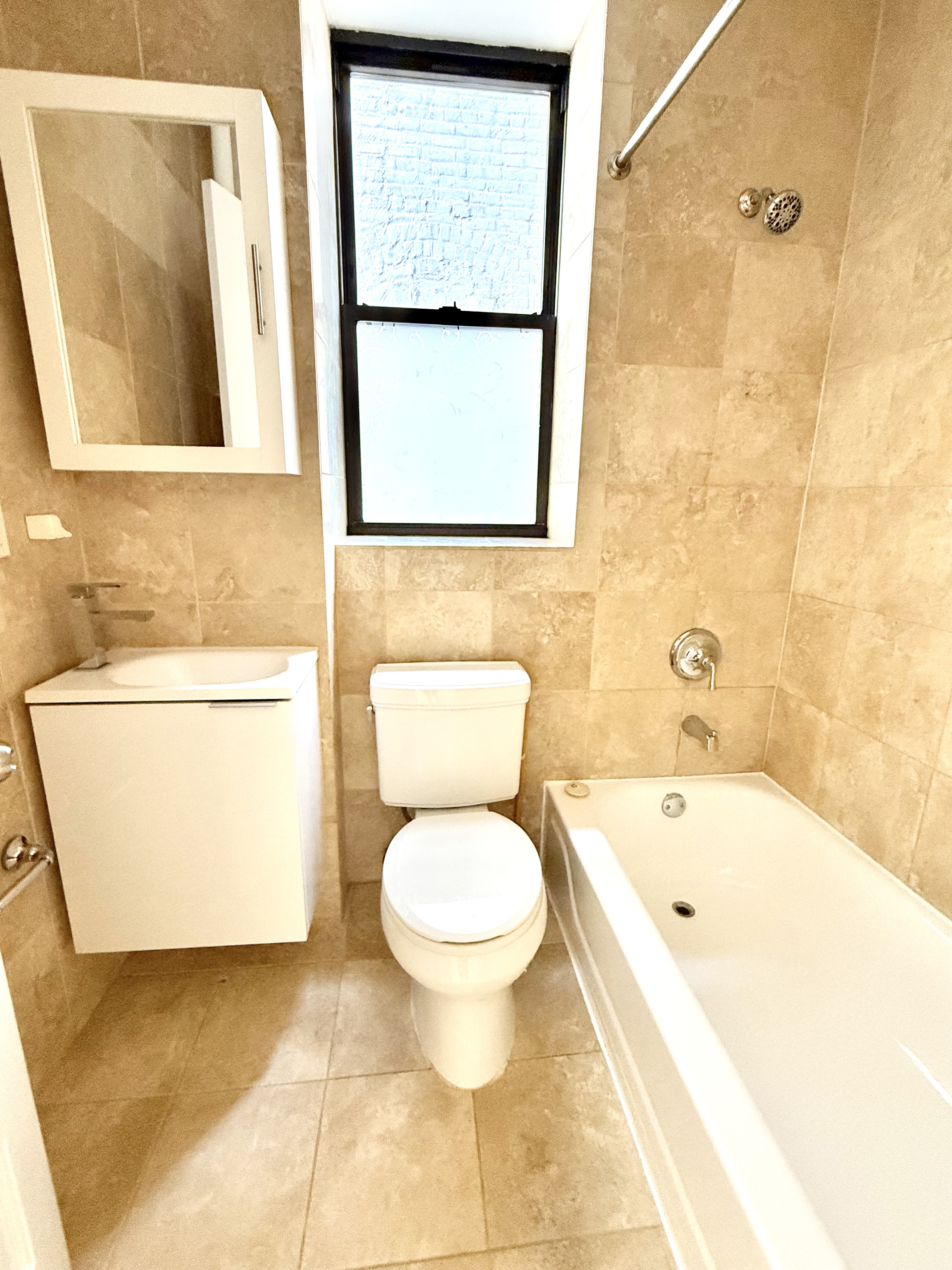 245 West 115th Street, Unit 16 Manhattan, NY 10026 - Photo 6 of 10 a bathroom with a toilet and a sink