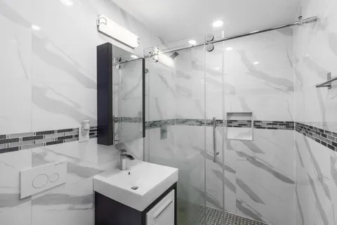 a bathroom with a sink and mirror