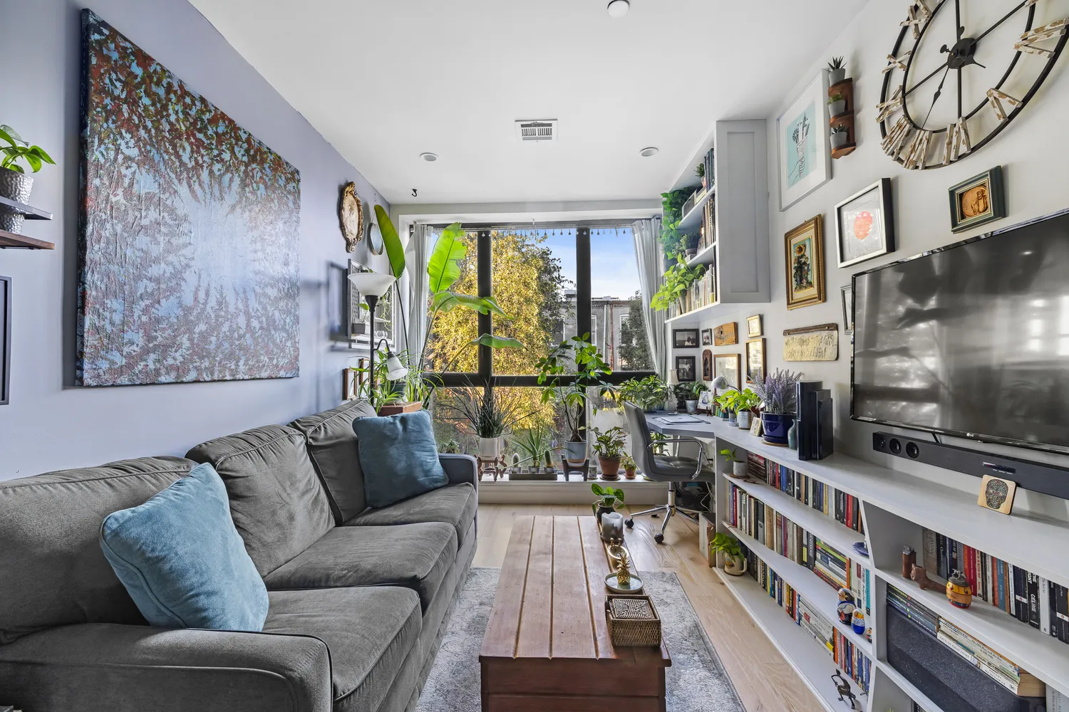 a living room with furniture and a flat screen tv