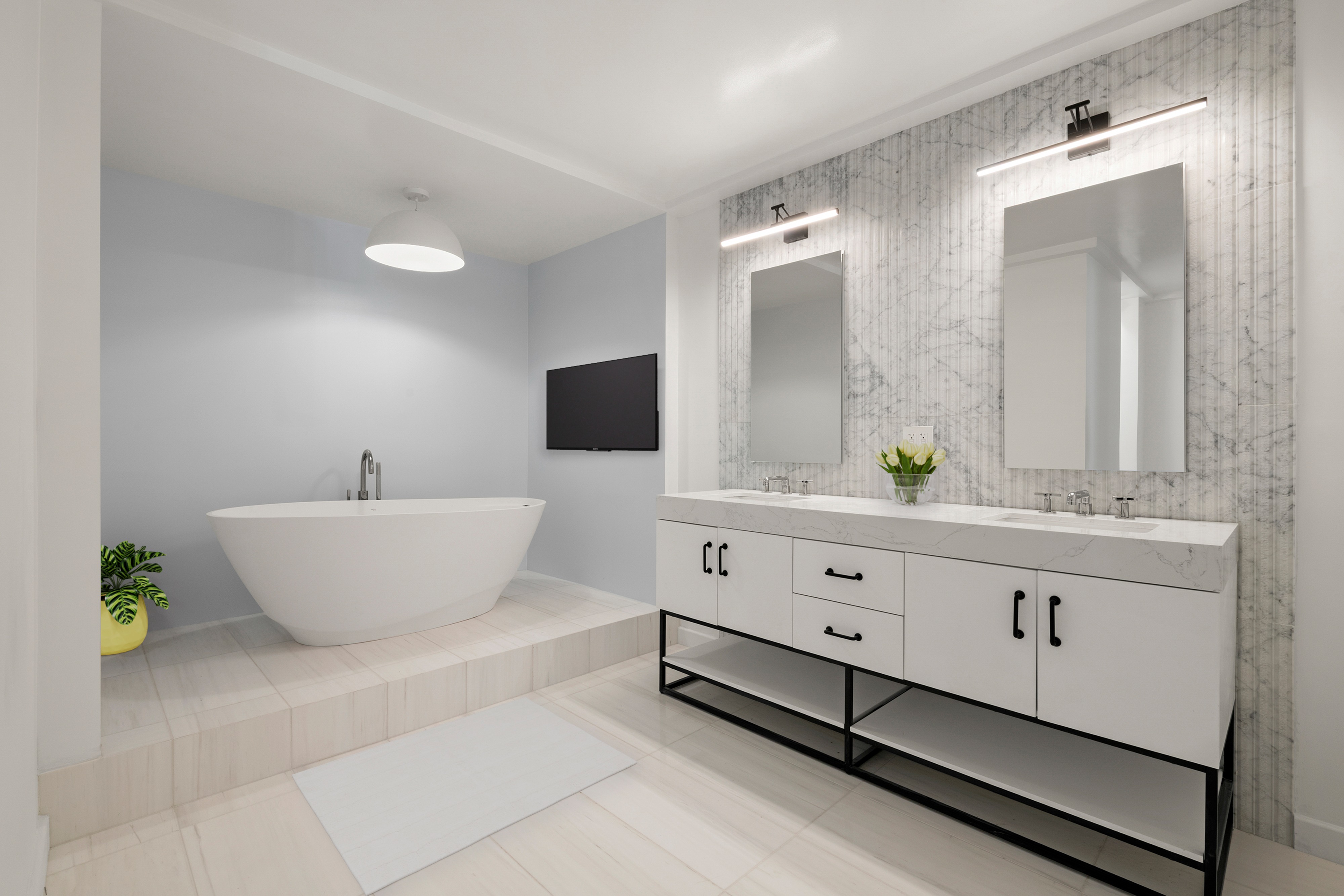 155 West 68th Street, Unit 1410 Manhattan, NY 10023 - Photo 7 of 11 a bathroom with a double vanity sink and a bathtub