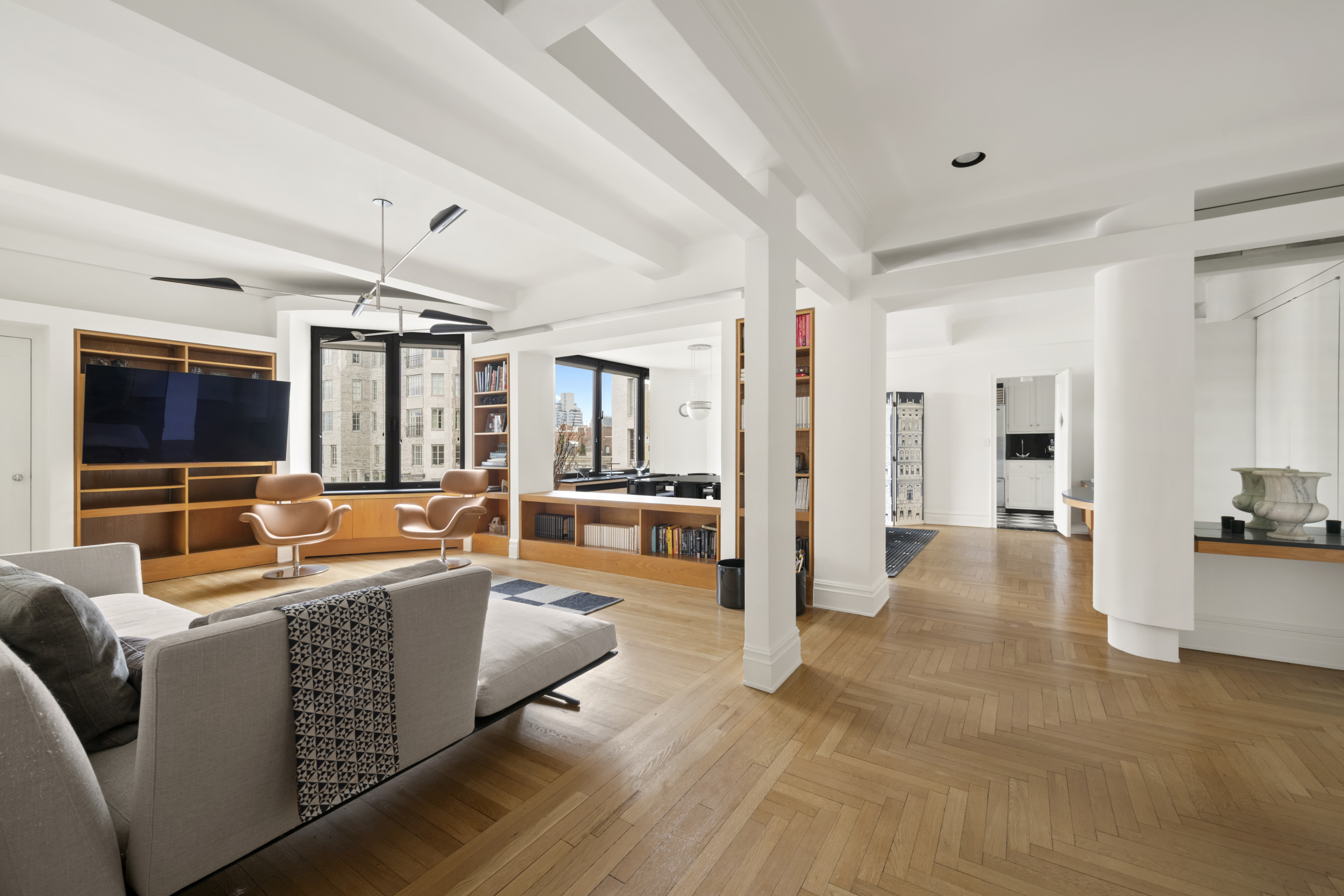 911 Park Avenue, Unit 14C Manhattan, NY 10075 - Photo 4 of 18 a living room with furniture and a flat screen tv