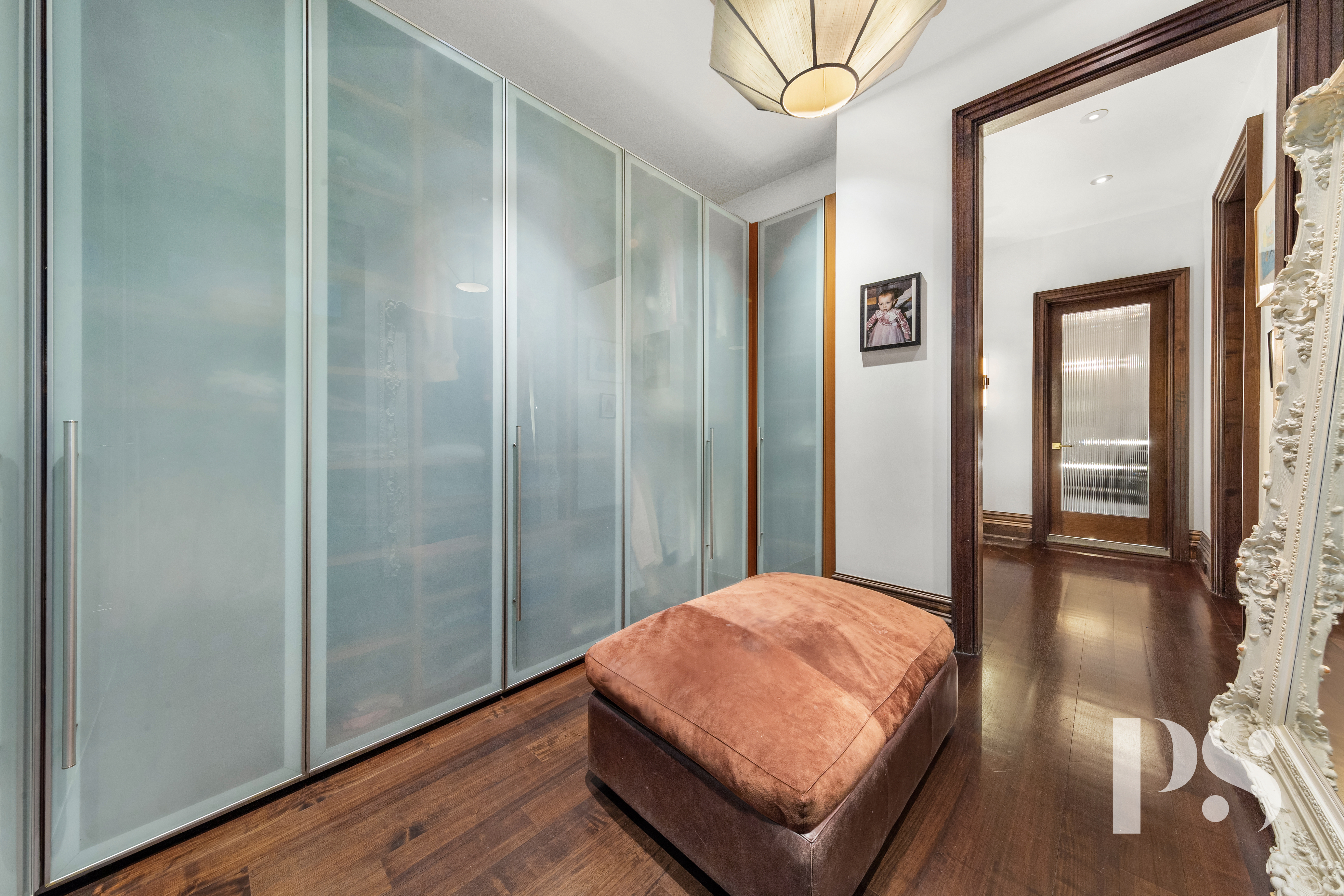 644 Broadway, Unit 2E Manhattan, NY 10012 - Photo 12 of 18 a bedroom with a bed and a mirror