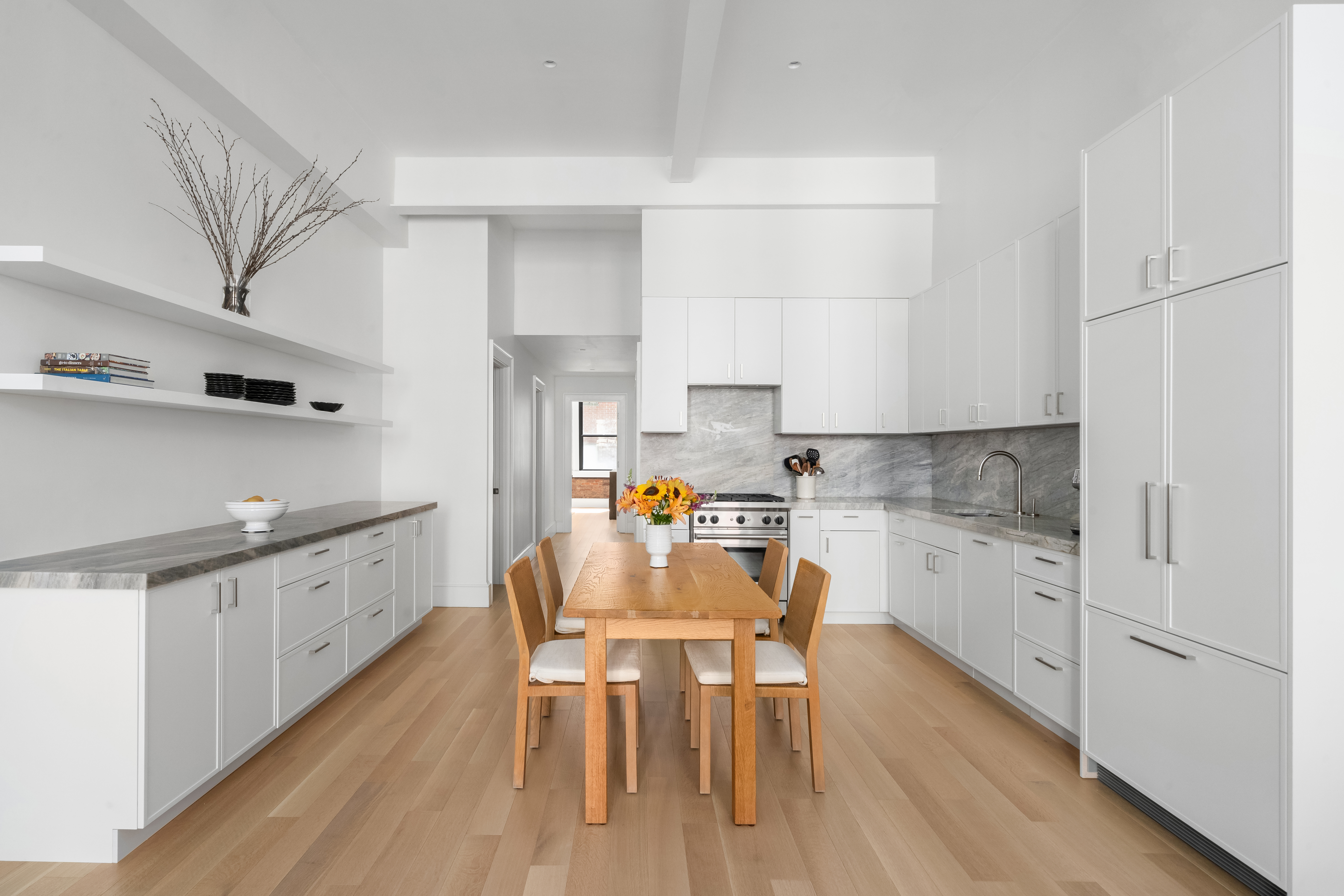 51 Warren Street, Unit 3W Manhattan, NY 10007 - Photo 4 of 13 a kitchen with granite countertop white cabinets and counter space