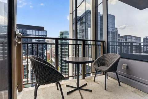 a view of a chairs on the roof deck