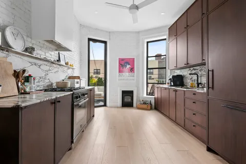 a kitchen with cabinets a sink and appliances