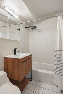 a bathroom with a bathtub and shower