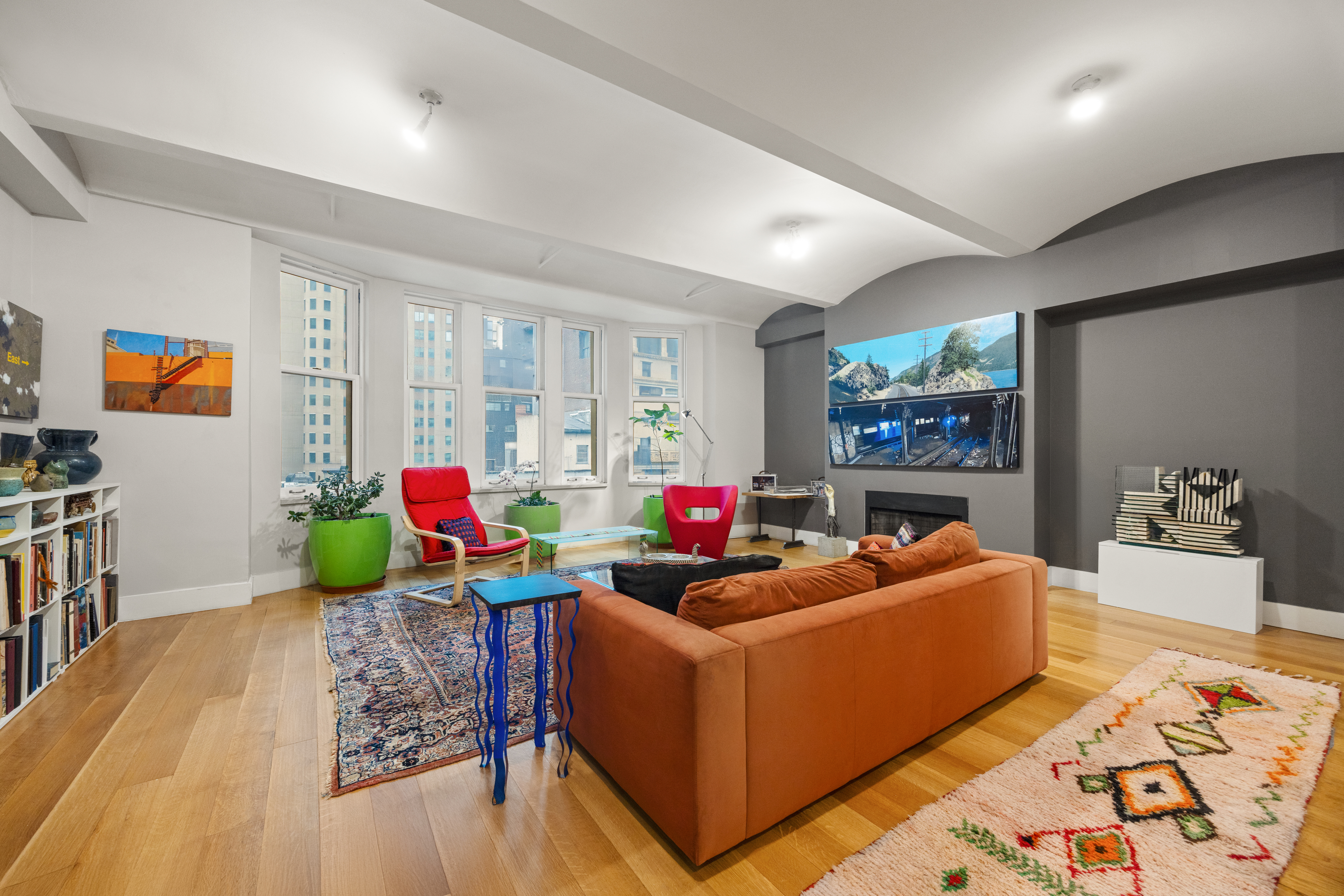 42 Ann Street, Unit 5 Manhattan, NY 10038 - Photo 1 of 16 a living room with furniture and a wooden floor