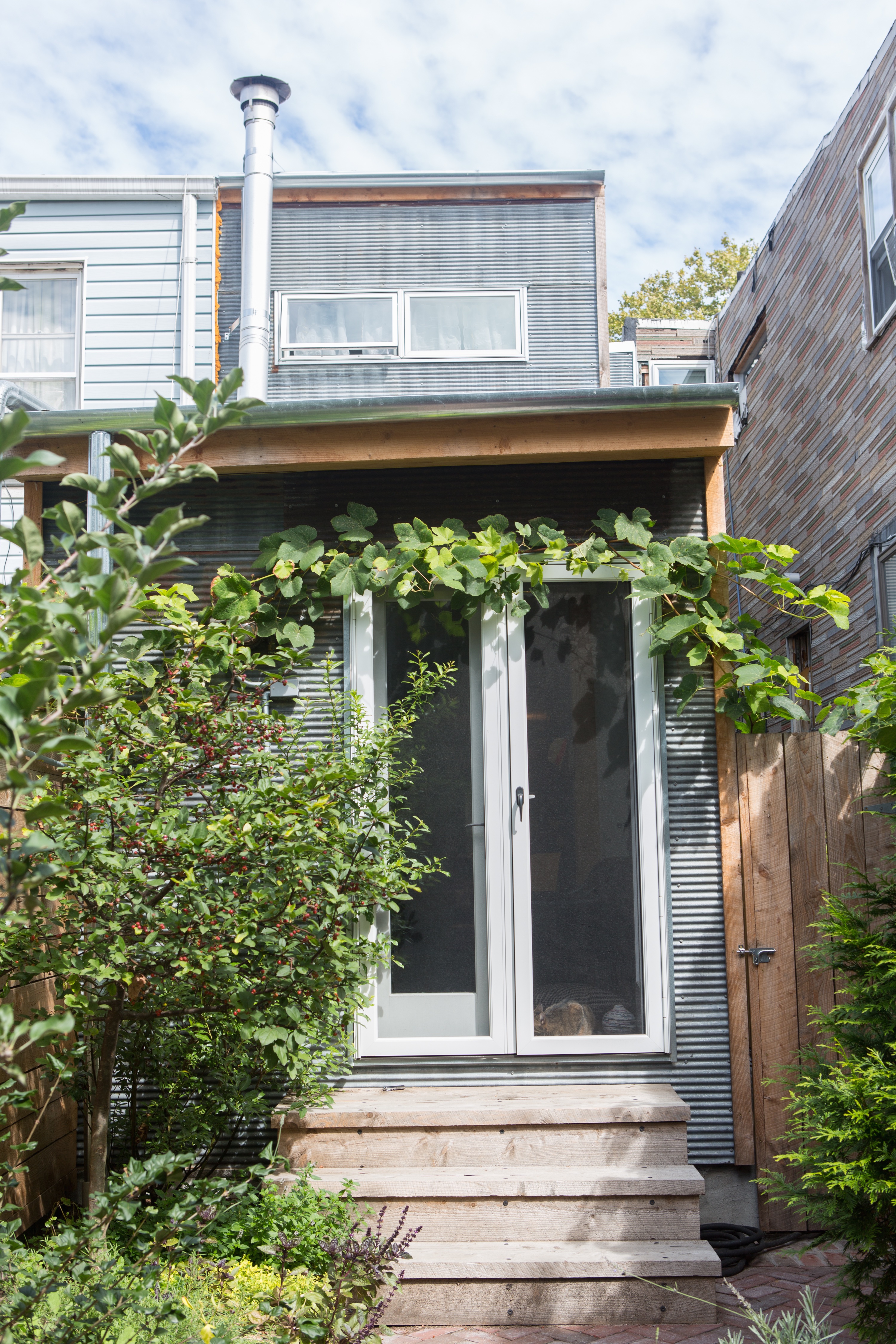 162 10th Street Brooklyn, NY 11215 - Photo 6 of 13 a front view of a house with a garden