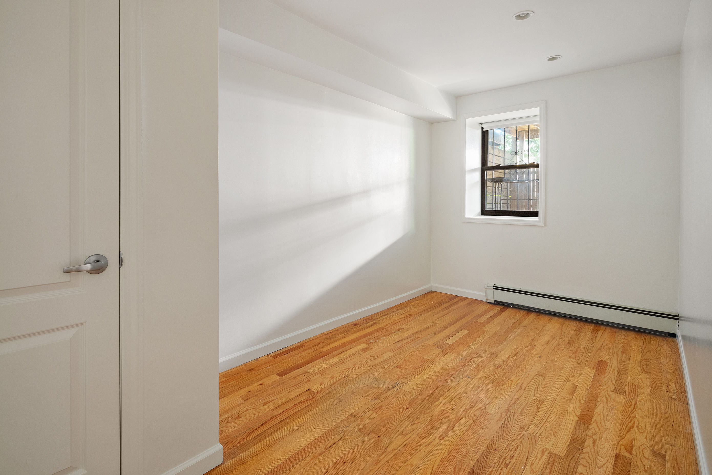 14 Covert Street, Unit 1 Brooklyn, NY 11207 - Photo 4 of 9 a view of room with window and hardwood floor
