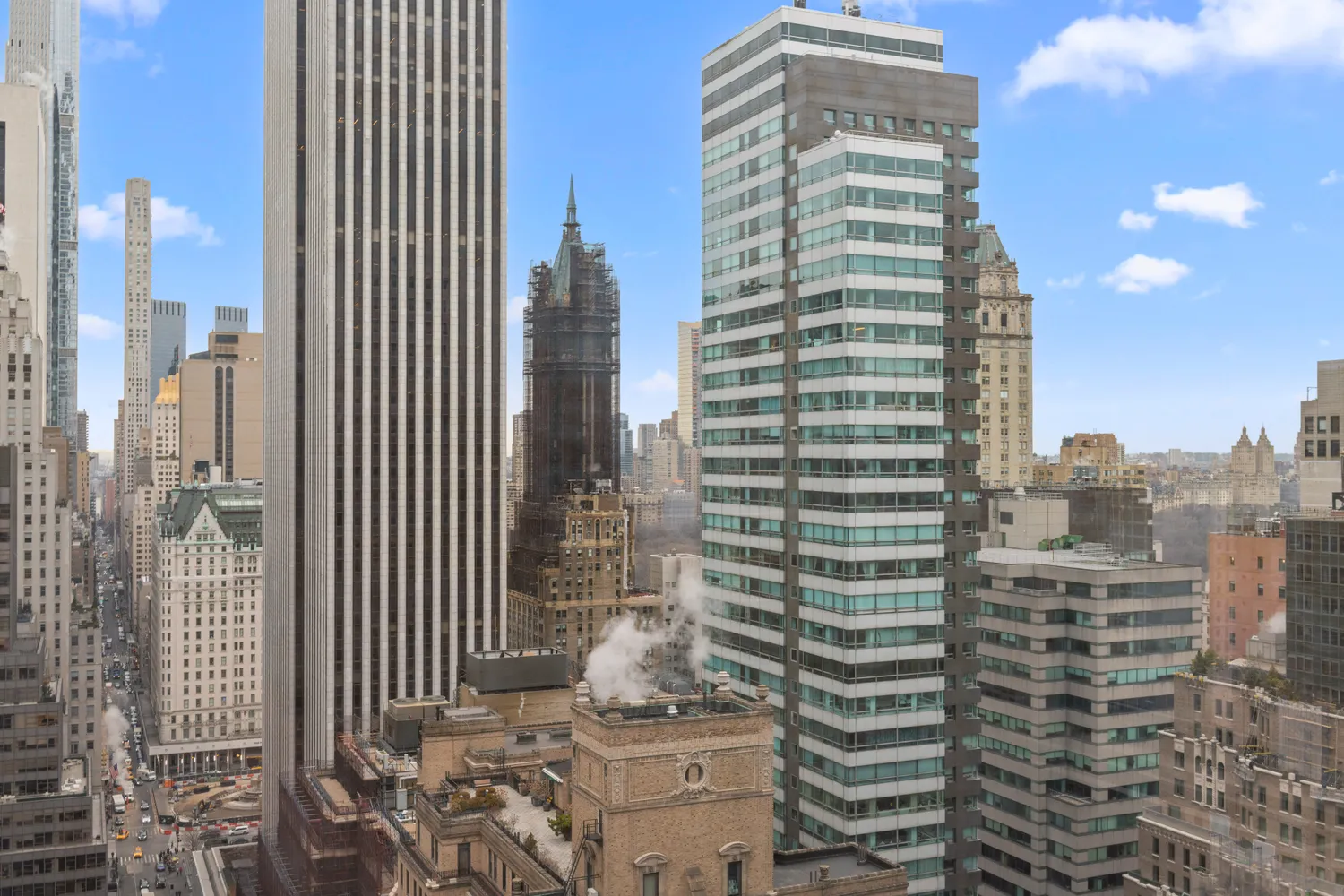 a view of roof deck with couches