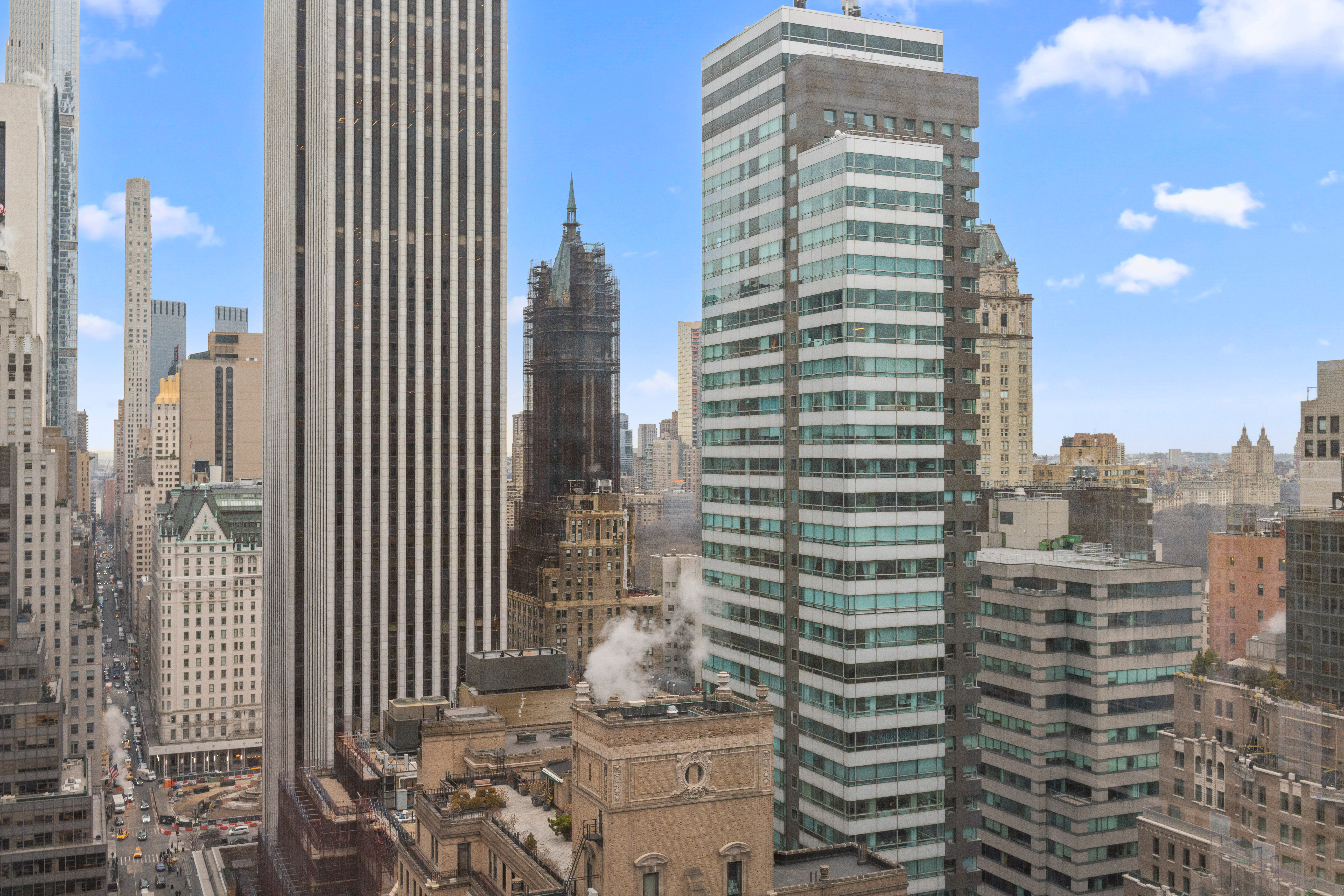 117 East 57th Street, Unit 35D Manhattan, NY 10022 - Photo 20 of 30 a view of a city with tall buildings