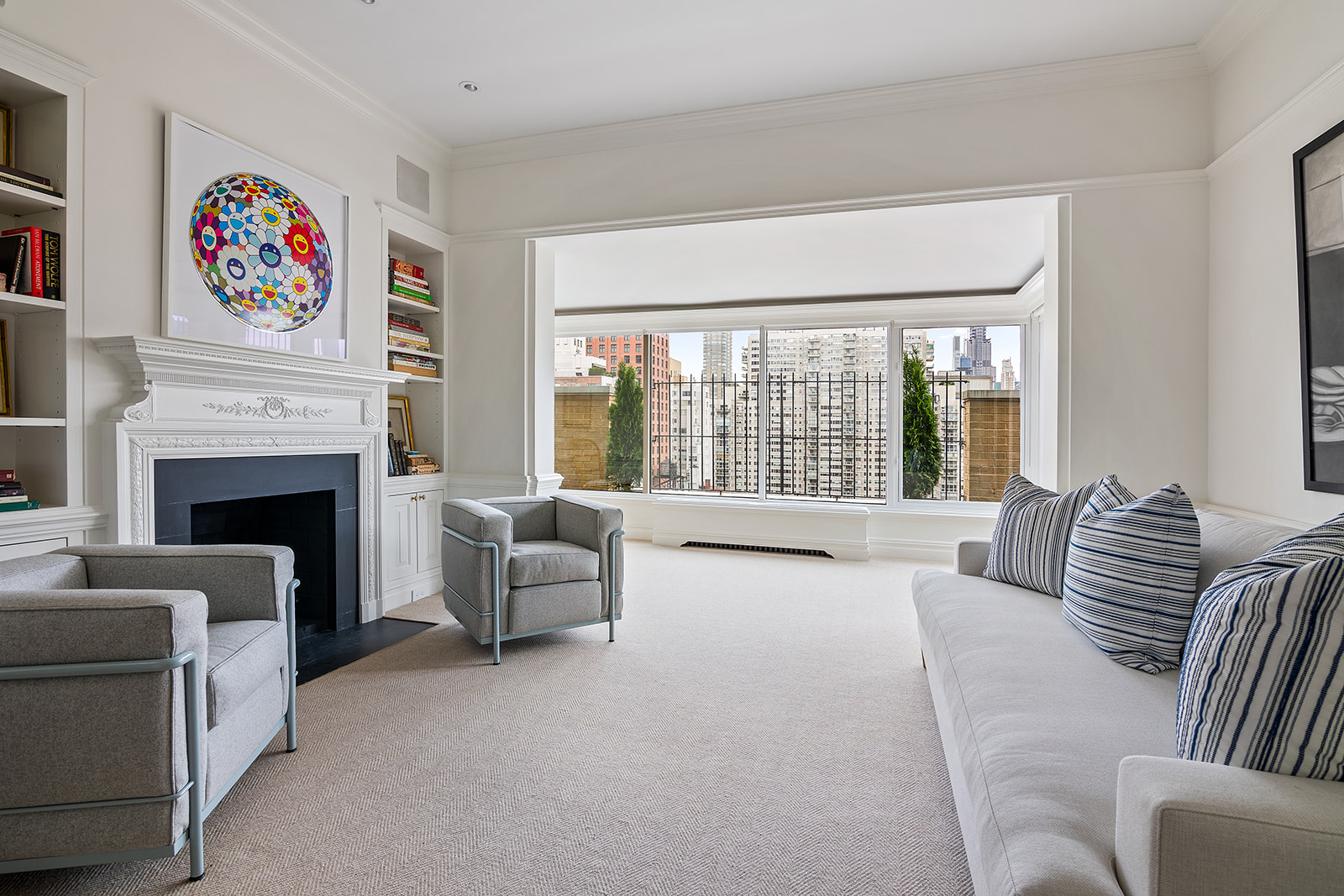164 East 72nd Street, Unit PHC Manhattan, NY 10021 - Photo 4 of 17 a living room with furniture and a fireplace