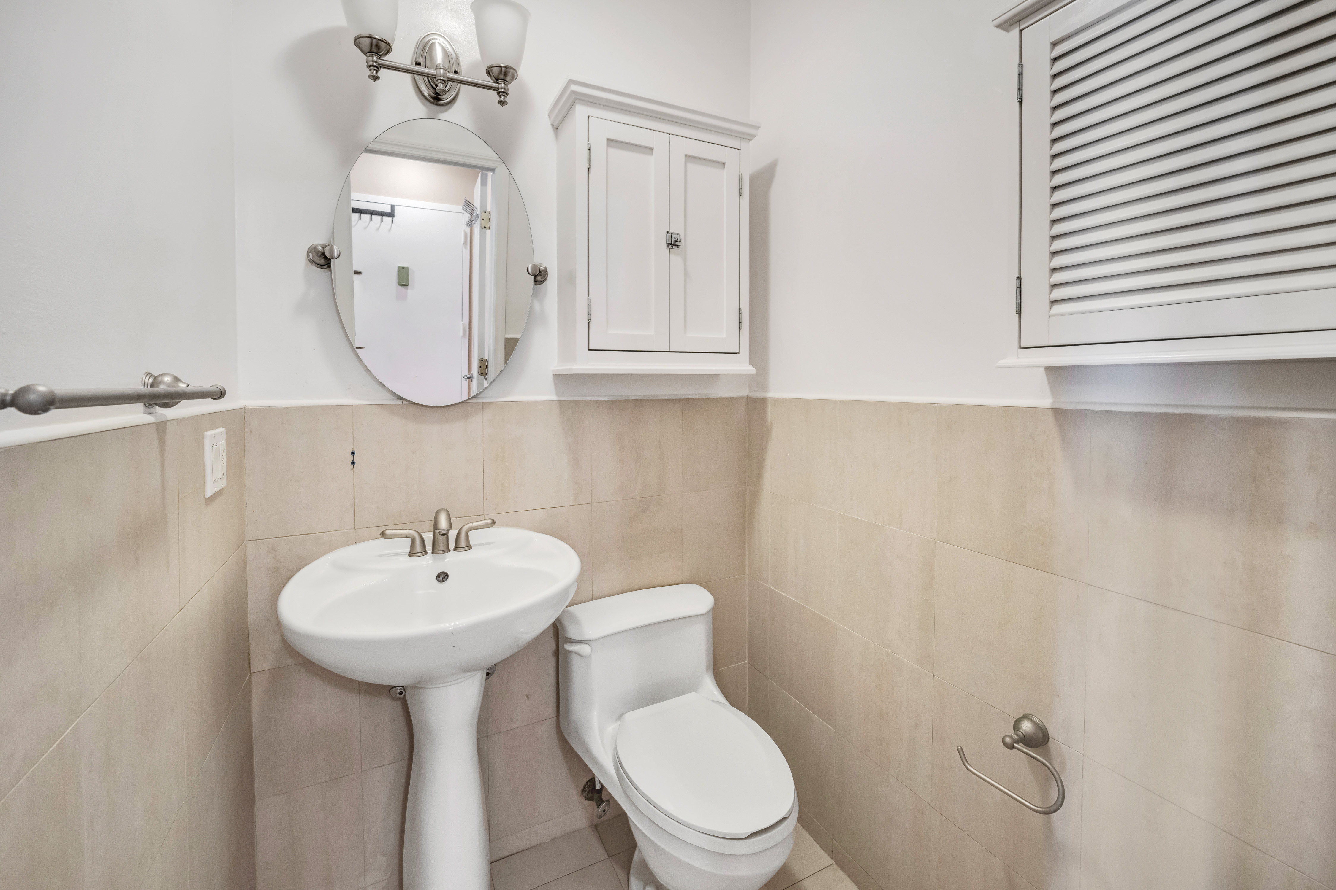 330 Bergen Street, Unit 1/C Brooklyn, NY 11217 - Photo 5 of 11 a bathroom with a sink a mirror and toilet