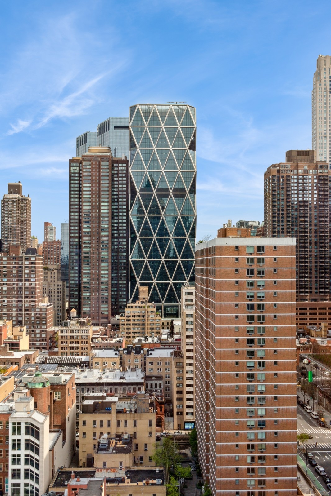 310 West 52nd Street, Unit 22H Manhattan, NY 10019 - Photo 11 of 12 a view of a city with tall buildings
