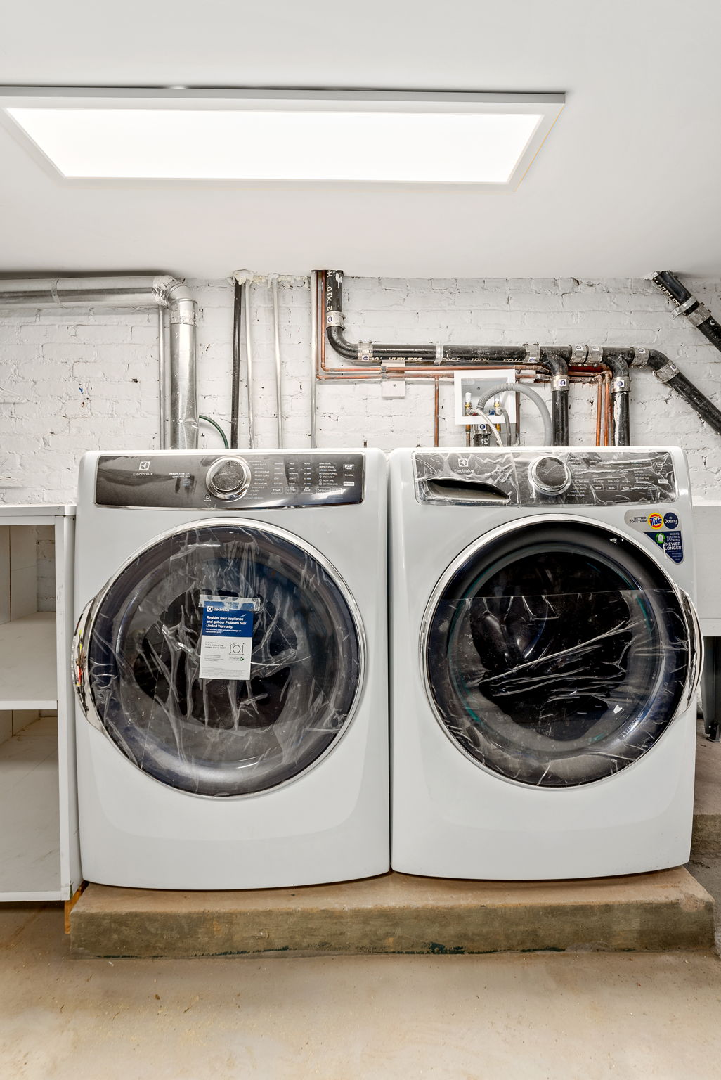 54 East 4th Street, Unit 1 Brooklyn, NY 11218 - Photo 8 of 12 a utility room with washing machine
